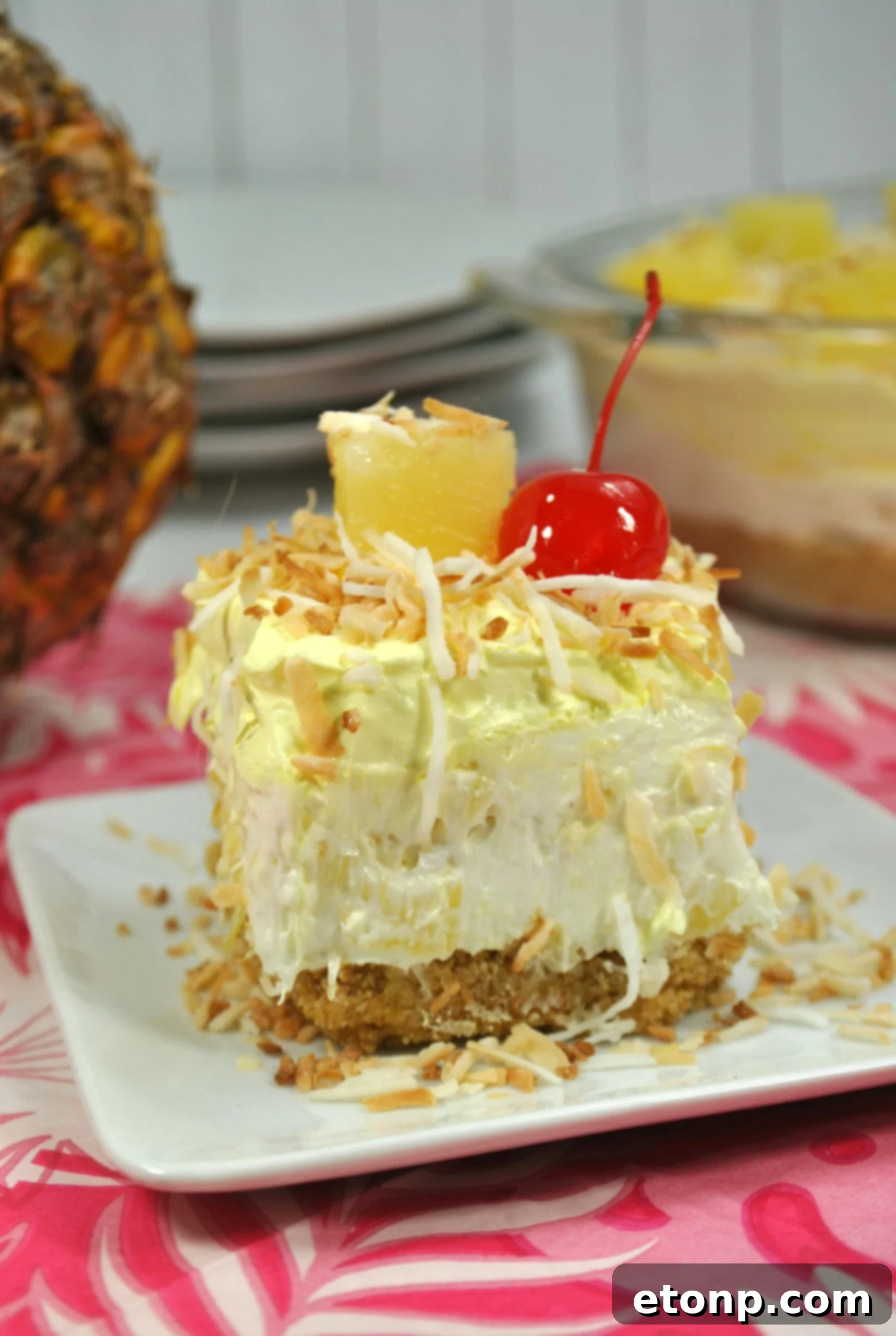 Several individual servings of No Bake Pineapple Dream Dessert in cupcake liners