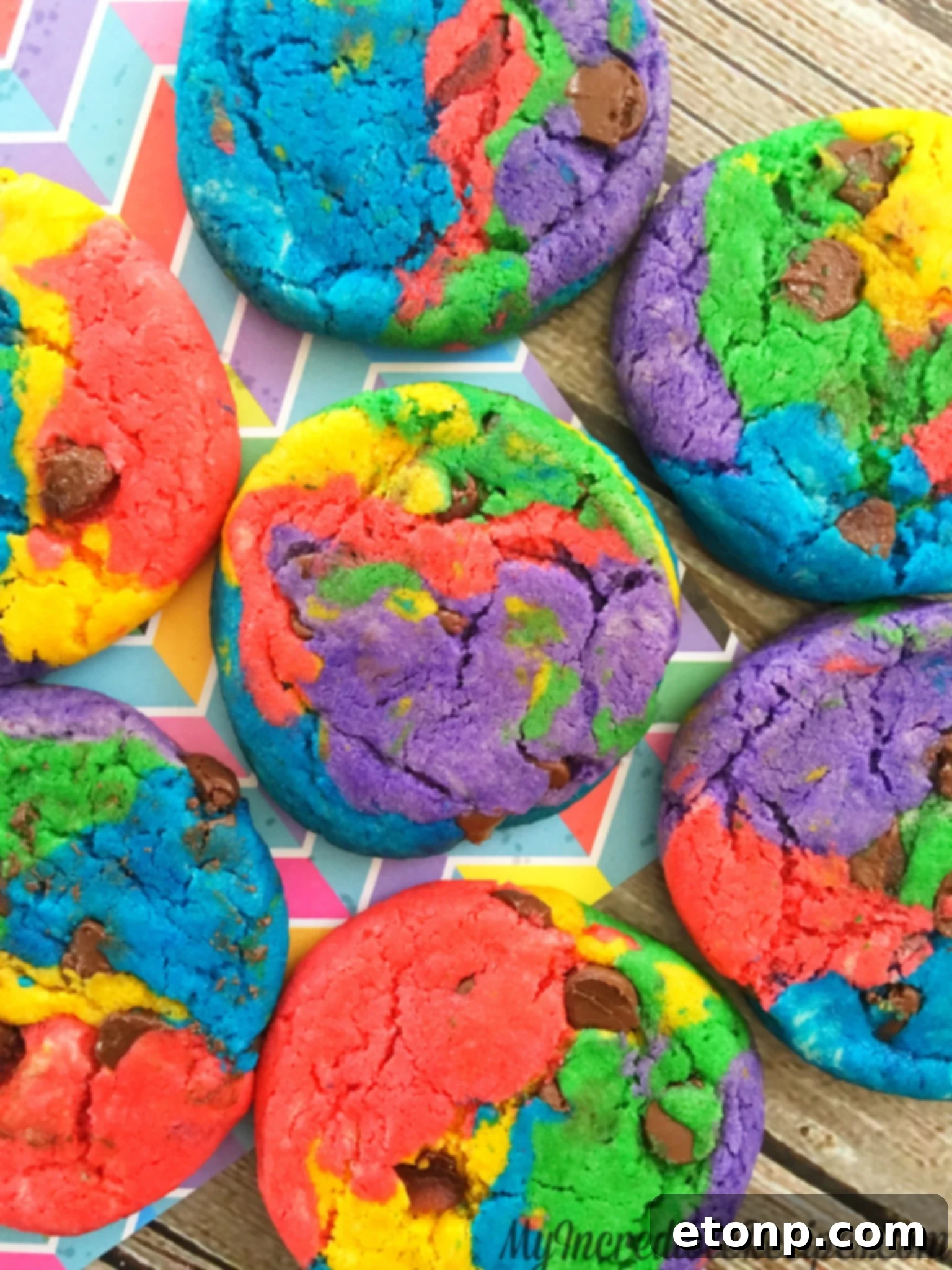 A jar overflowing with homemade rainbow chocolate chip cookies, ready for sharing or storage