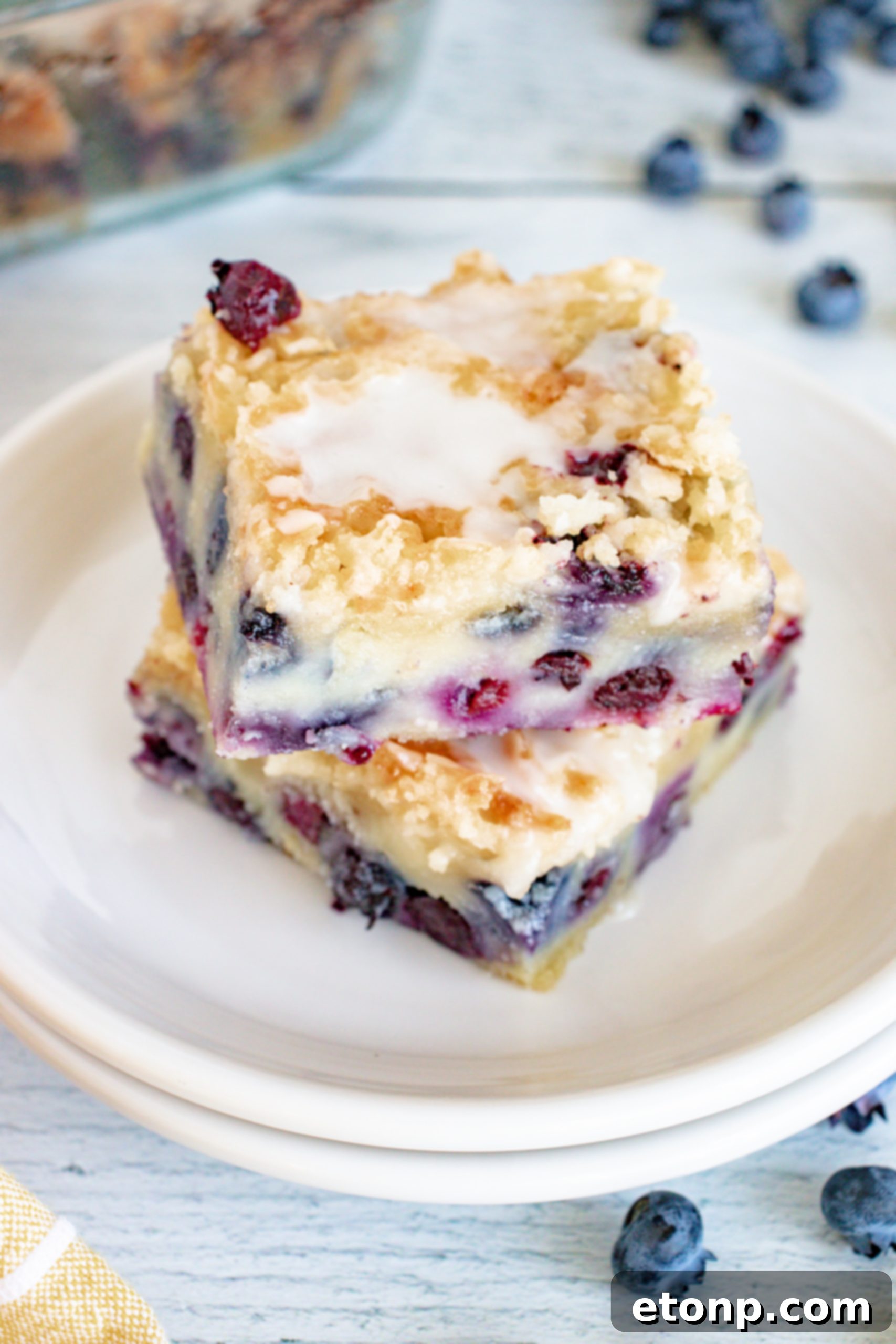 Close-up of the streusel topping on the blueberry muffin cake, highlighting its golden-brown texture