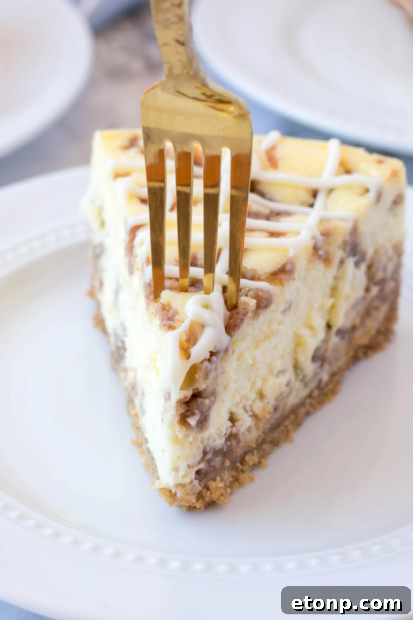 A top-down view of the baked Cinnamon Roll Cheesecake, before the final cream cheese icing is added.
