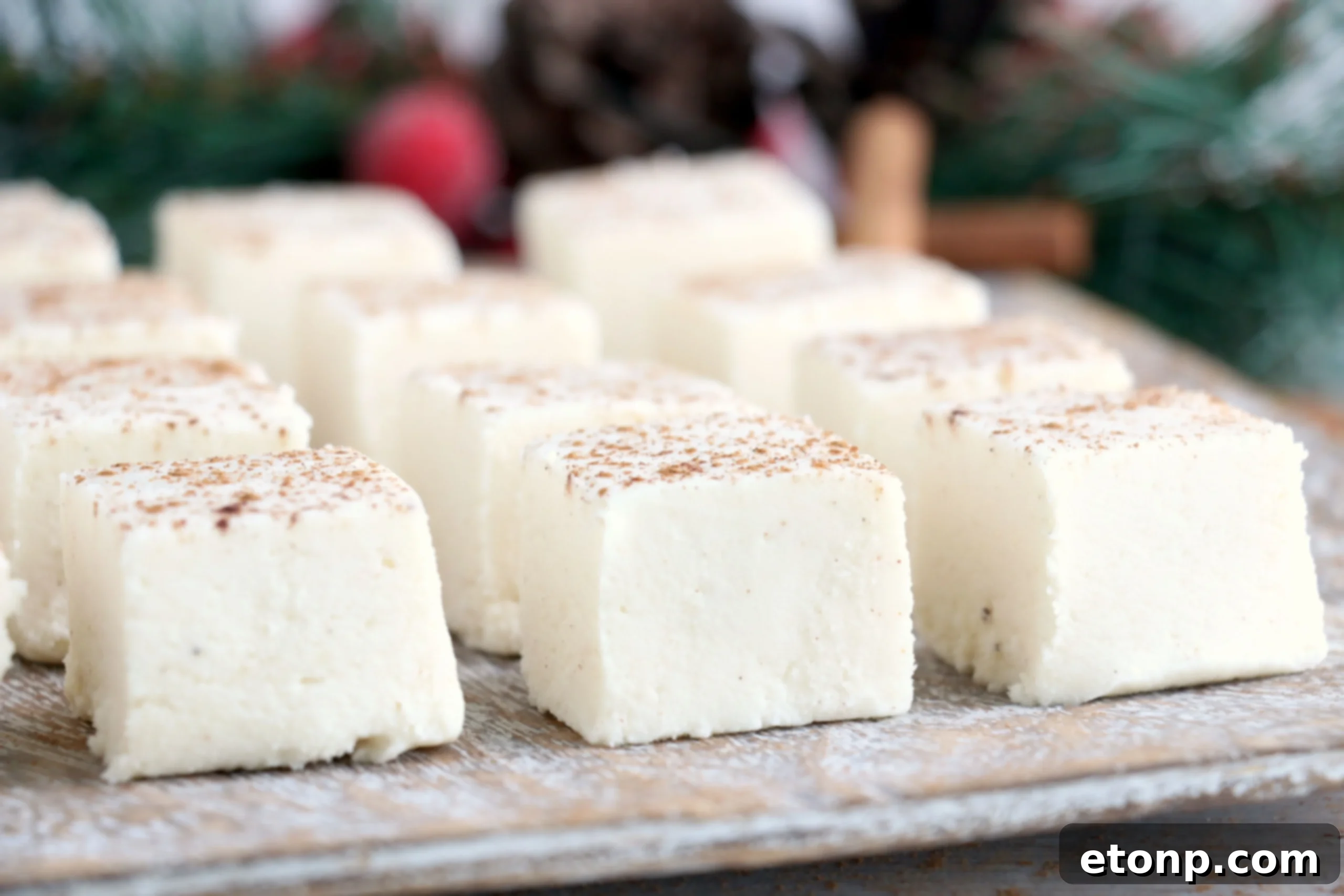 Close-up of a single piece of eggnog fudge, highlighting its creamy texture and festive appeal.