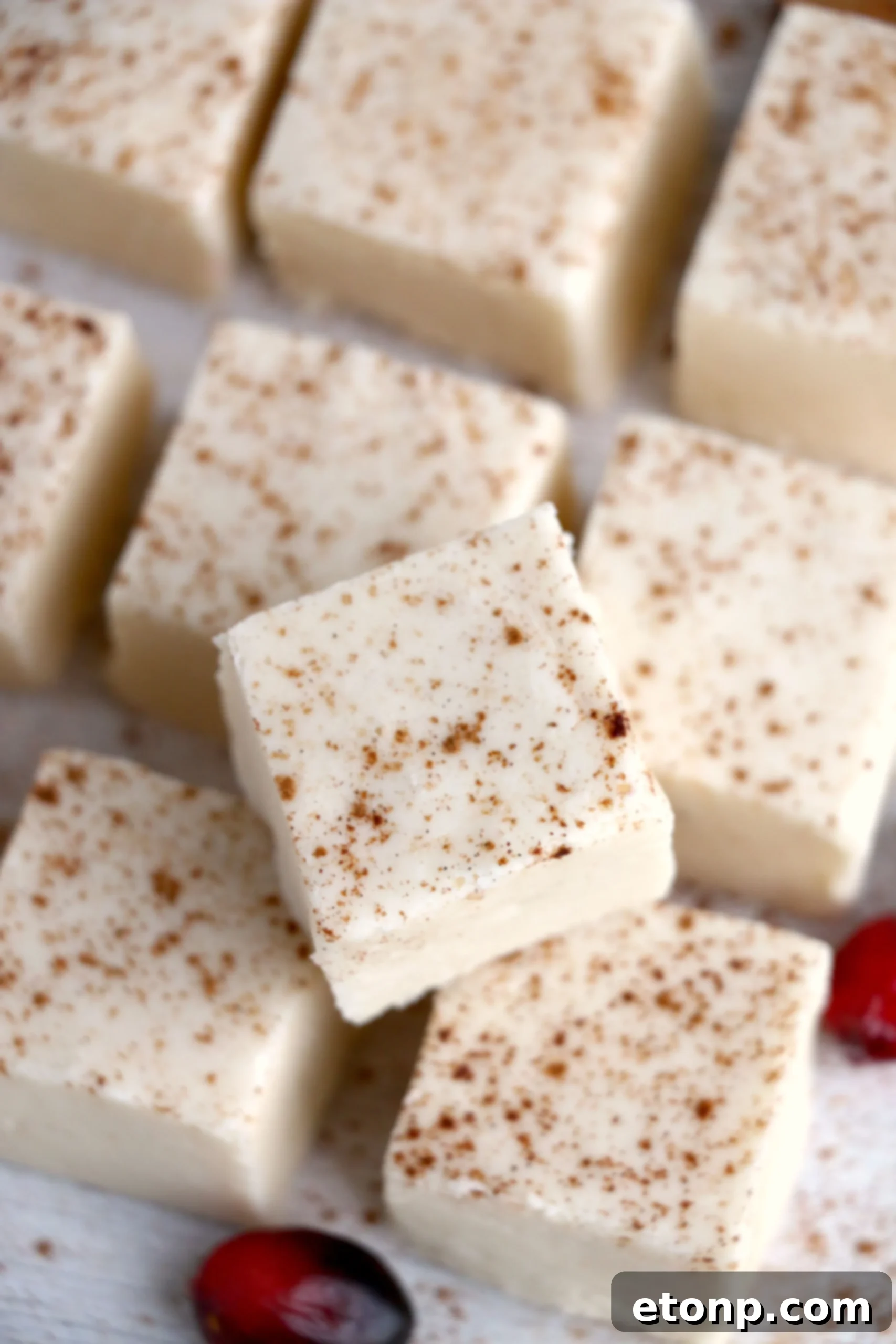 A festive holiday setup with eggnog fudge, illustrating its seasonal appeal.