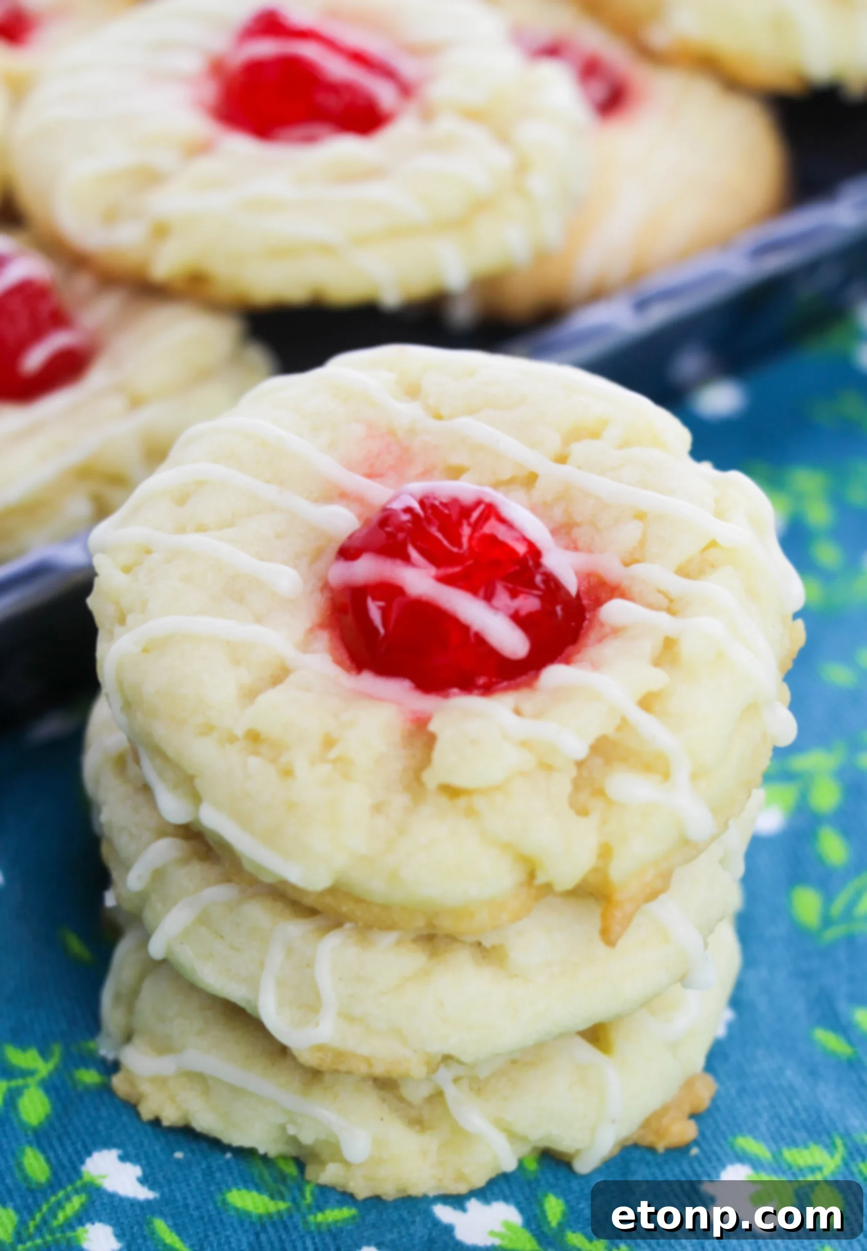 Eggnog Thumbprint Cookies artfully arranged with holiday decorations, emphasizing their festive appeal.