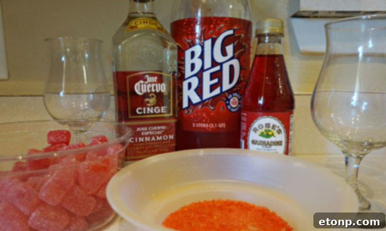 Close-up of a Red Hot Love cocktail with cinnamon stick garnish