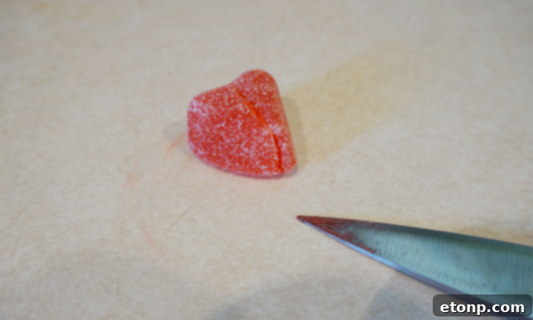 Finished Red Hot Love cocktail with gummy heart garnish