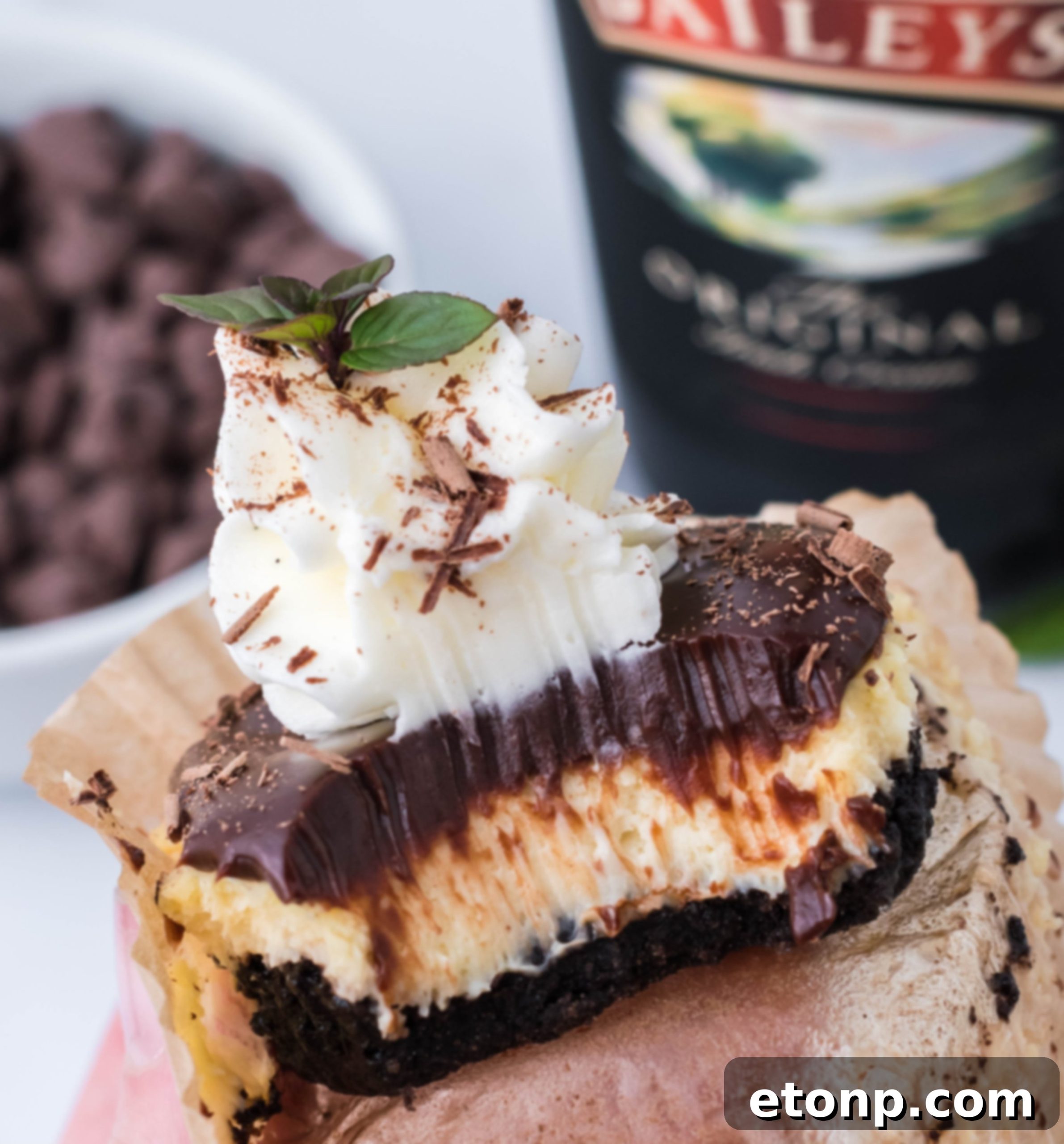 Mini Baileys Cheesecakes topped with chocolate ganache