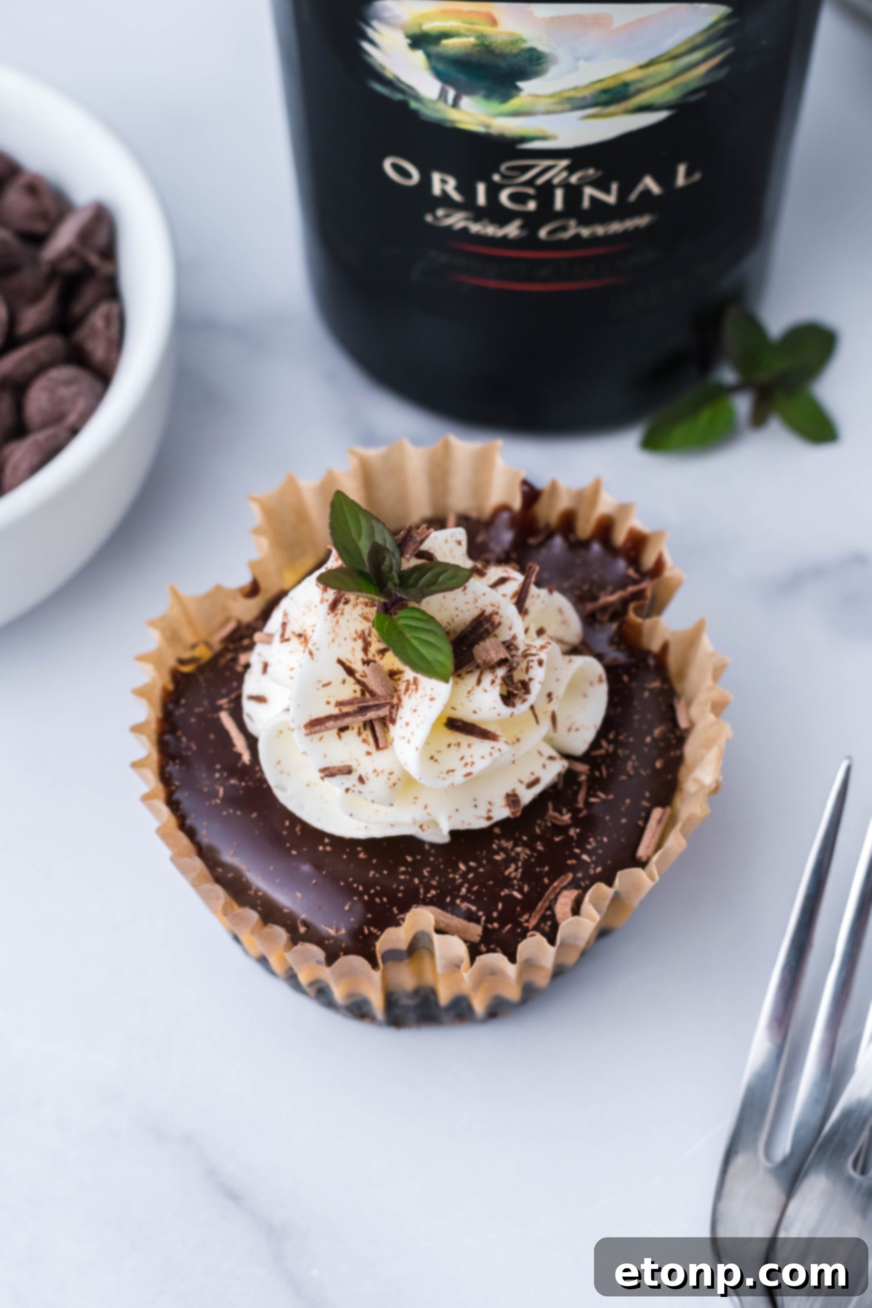 Close-up of a mini Baileys cheesecake, showing the layers