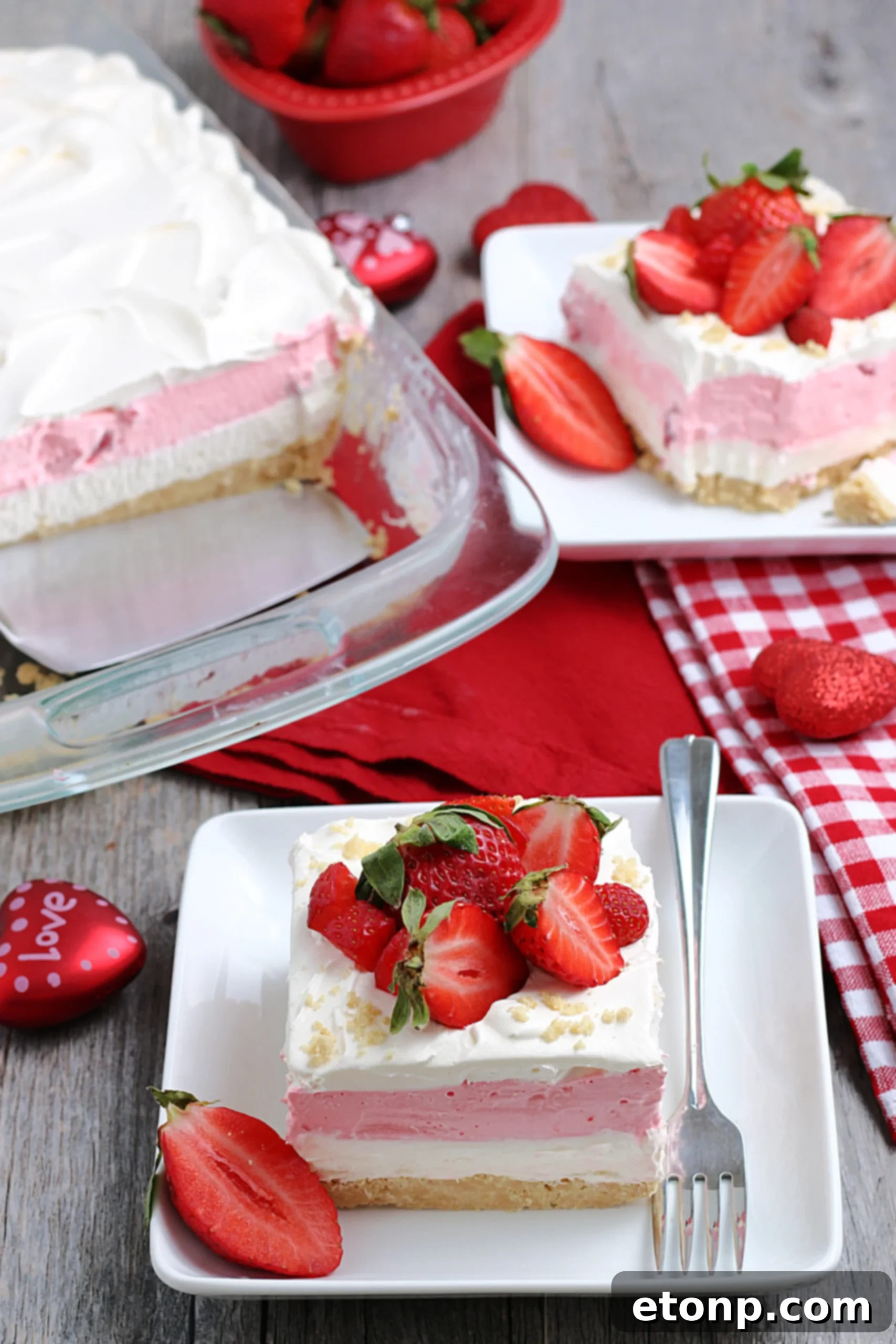 A large pan of Strawberry Cheesecake Lasagna, freshly prepared and ready to be chilled, showcasing its appealing layers.
