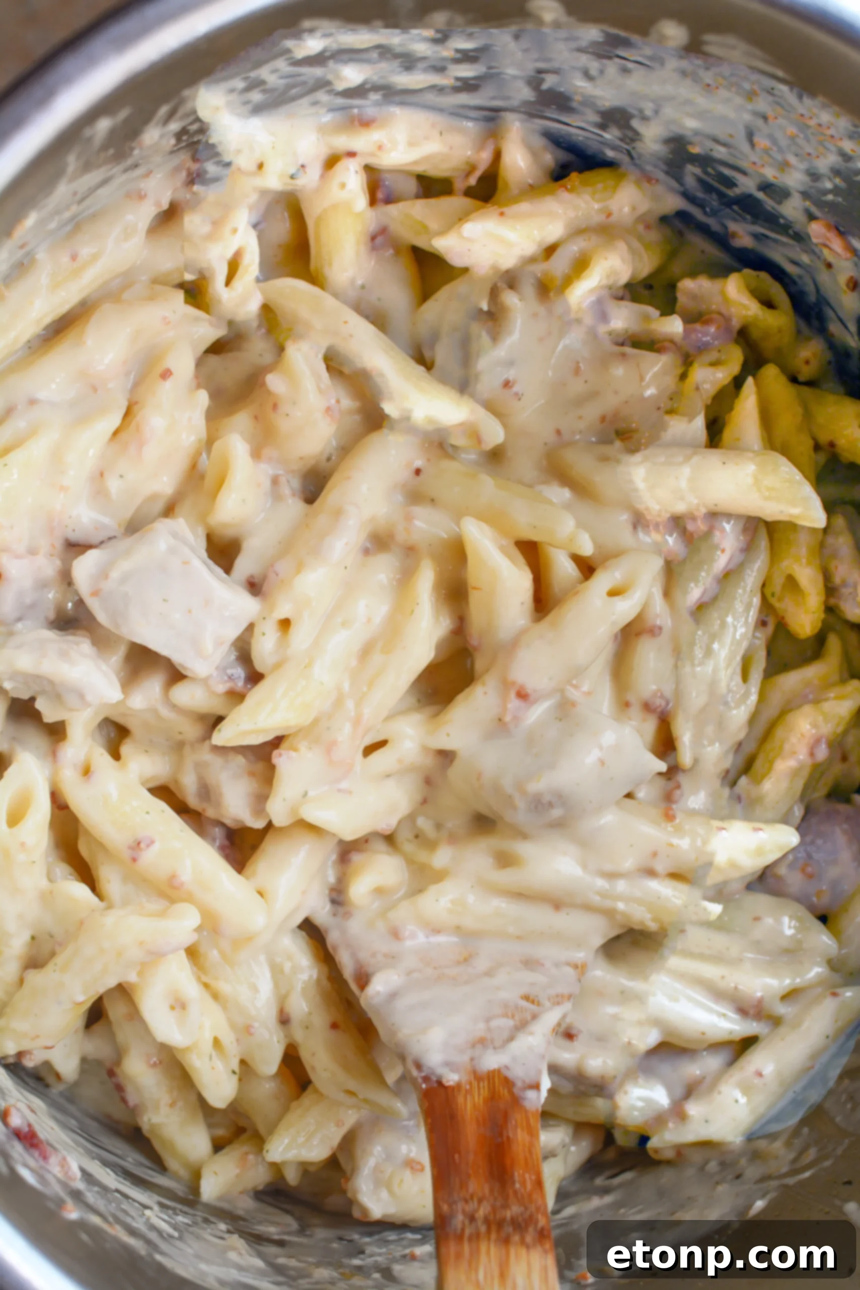 Instant Pot Crack Chicken Pasta served in a bowl, garnished with fresh parsley.