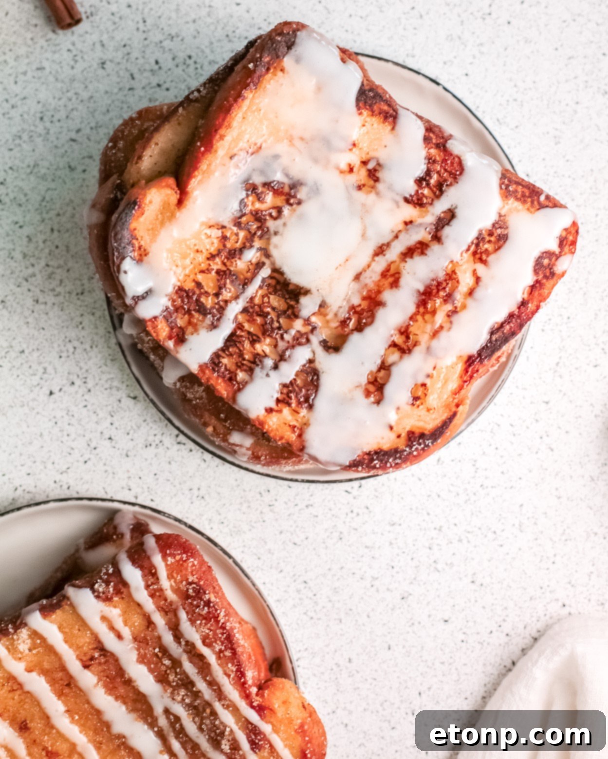 Churro Cinnamon Sugar French Toast served with whipped cream, berries, and various sweet sauces.
