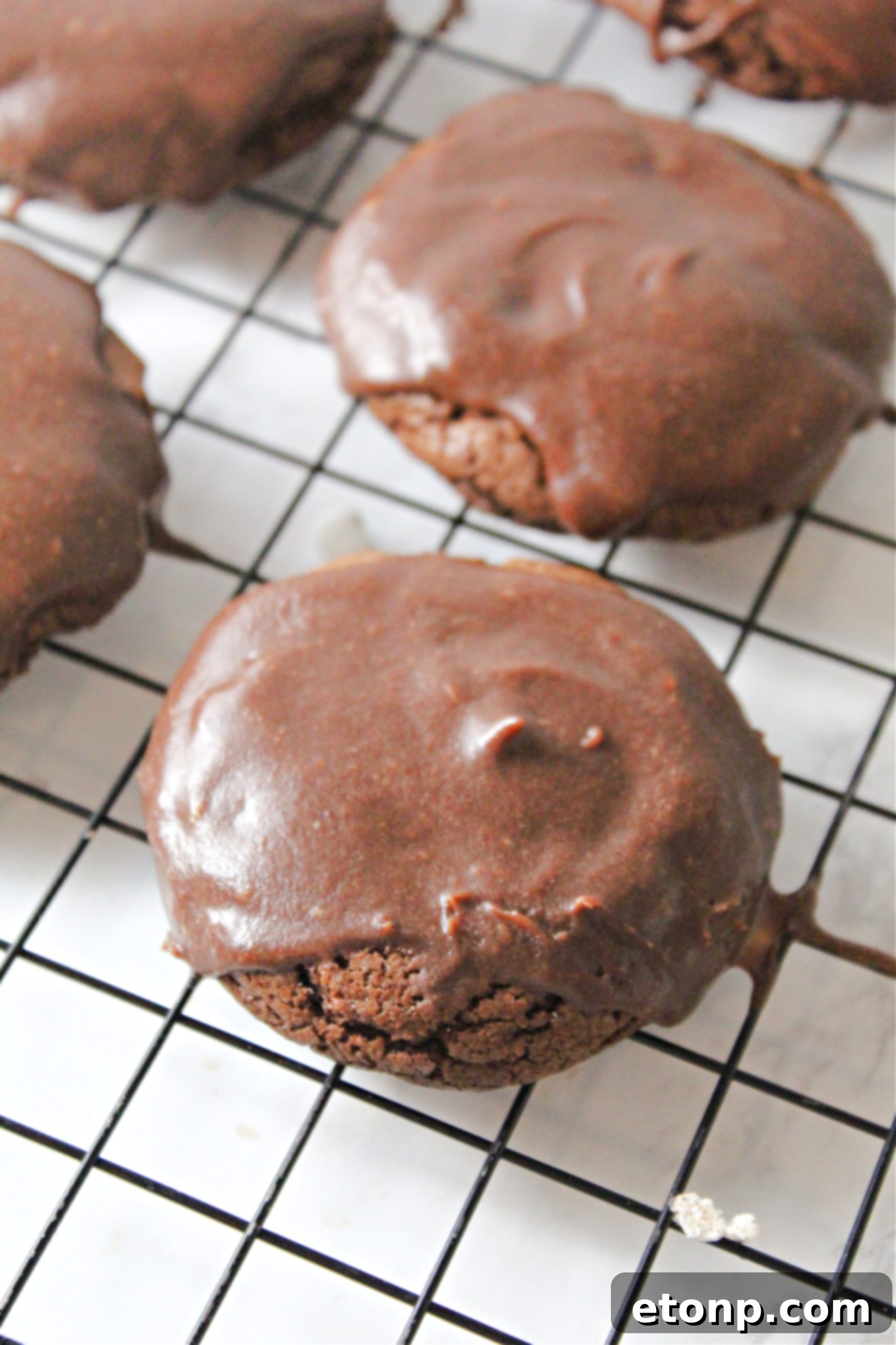 Freshly baked Texas Sheet Cake Cookies cooling on a wire rack, waiting for their decadent frosting.