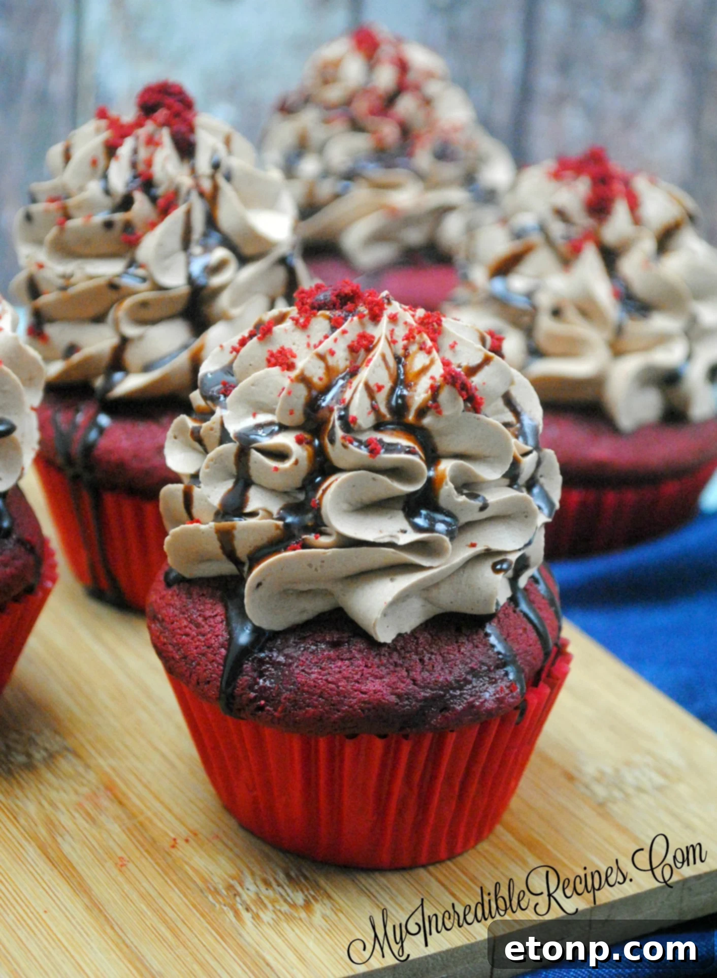 A stack of red velvet cupcakes, perfectly baked and ready to be enjoyed