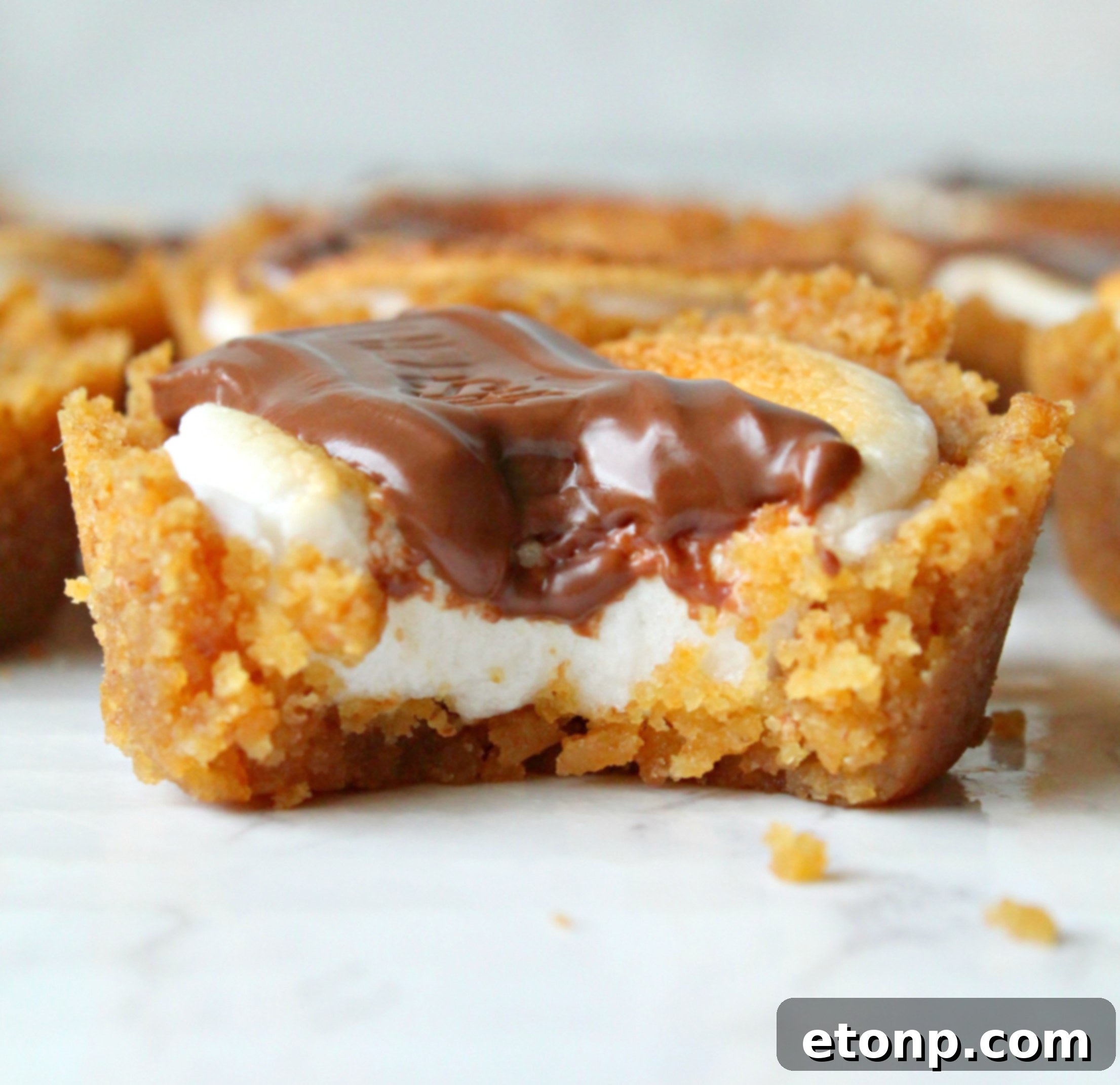 Fireside S'mores Cookie Bites 9 Properly stored S'mores Cookie Cups in an airtight container, ready for preservation.