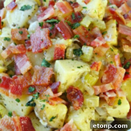 Final German Potato Salad with fresh parsley garnish, ready for serving