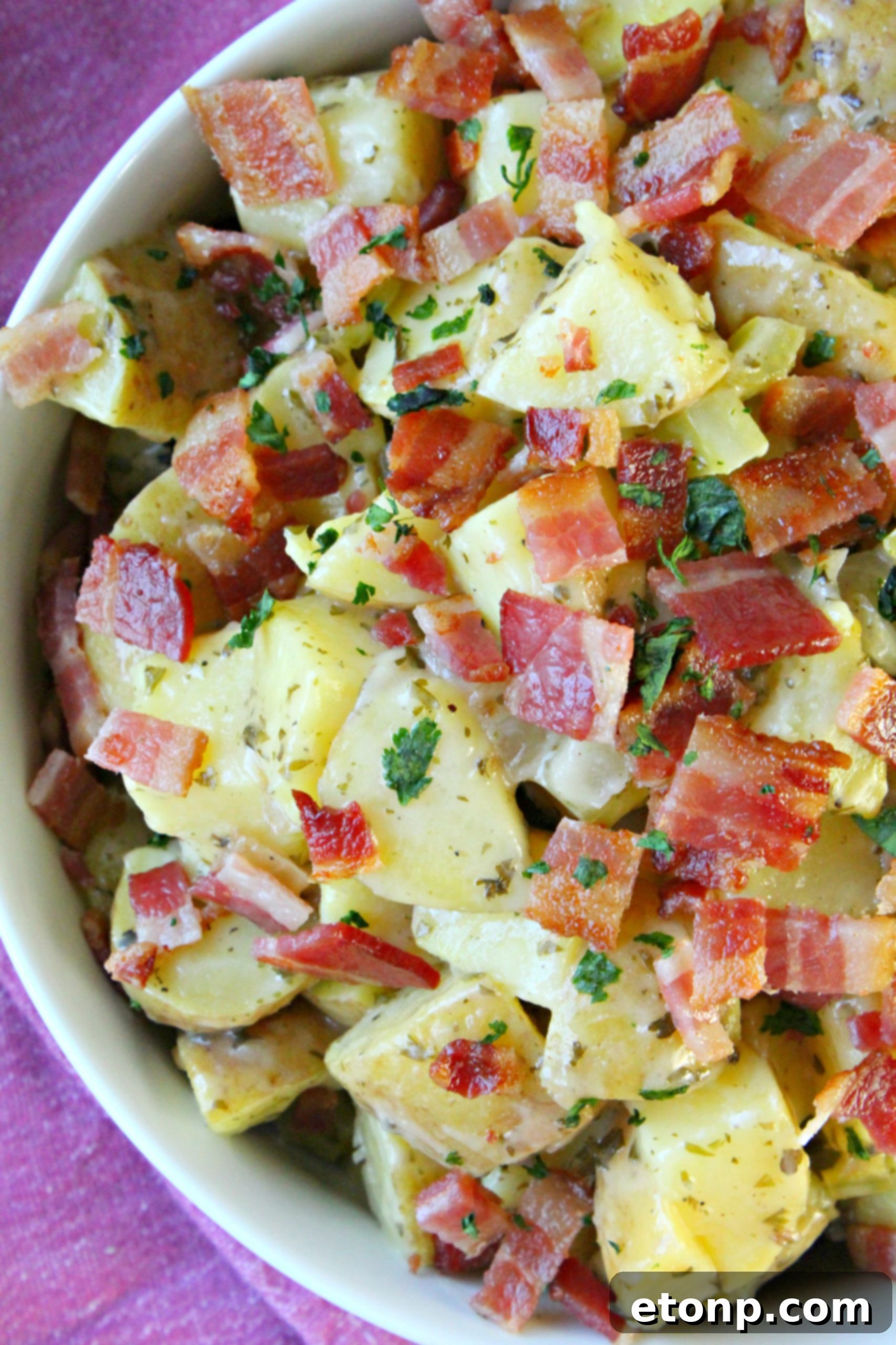 Chopped yellow potatoes ready for cooking, neatly arranged on a cutting board