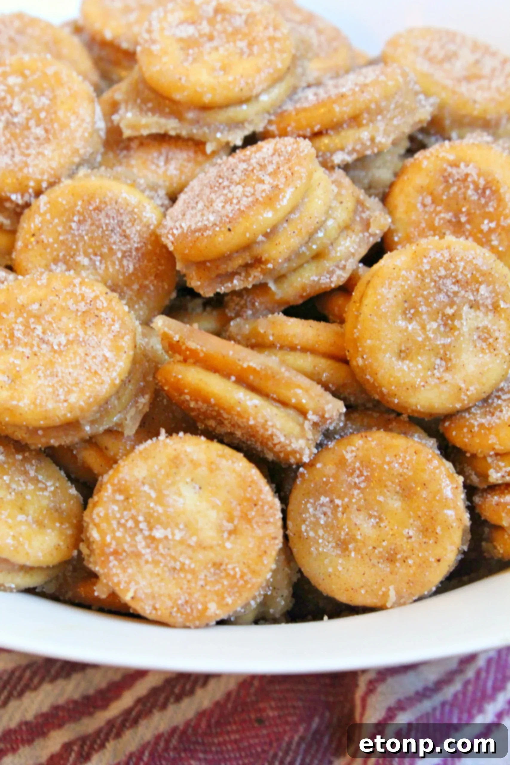 Ritz Churro Bites freshly baked on a baking sheet, still warm and bubbly.