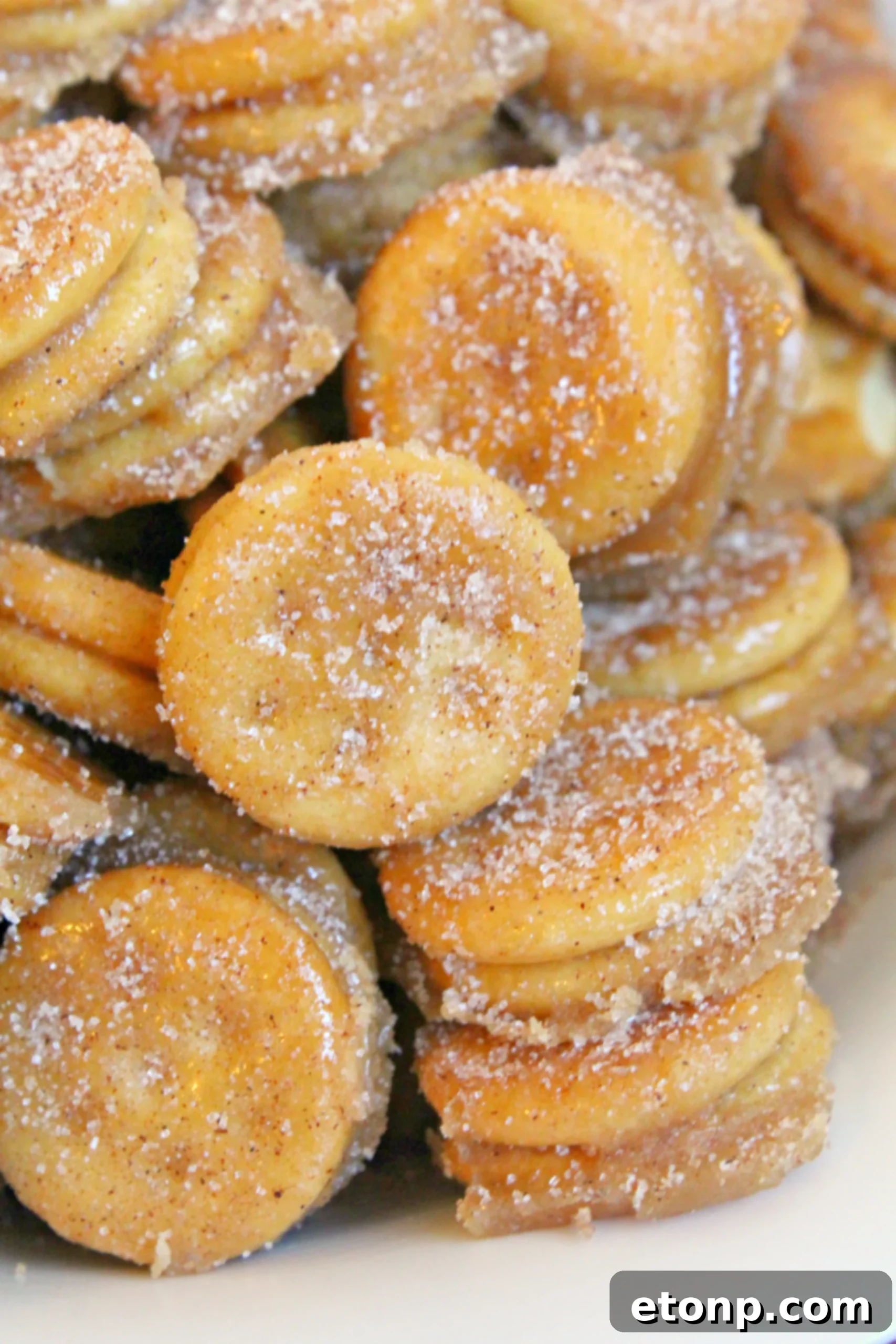 Ritz Churro Bites in a clear glass container, ready for storage or serving.