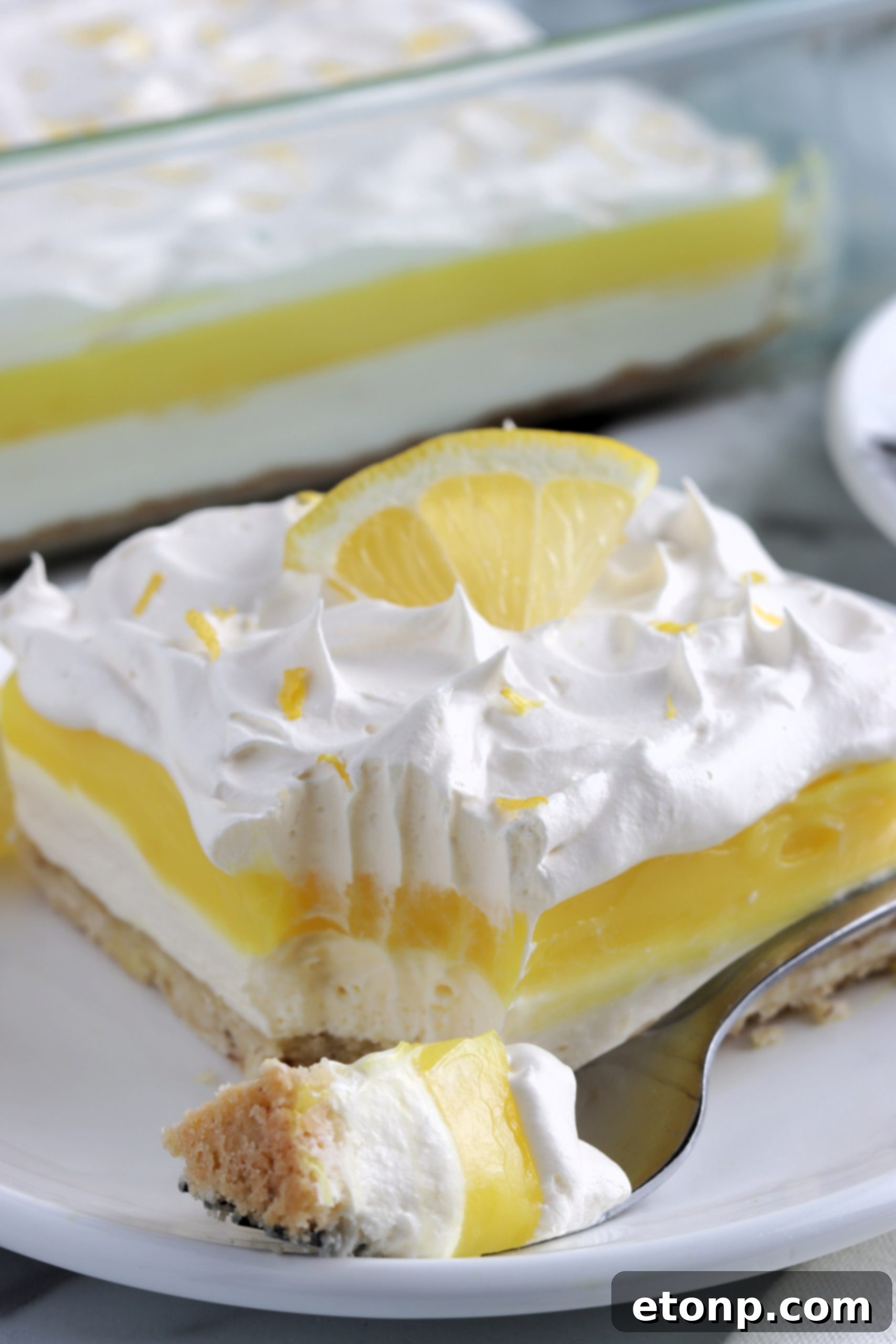 Blocks of cream cheese on a counter, ready for use, emphasizing the creamy ingredient.