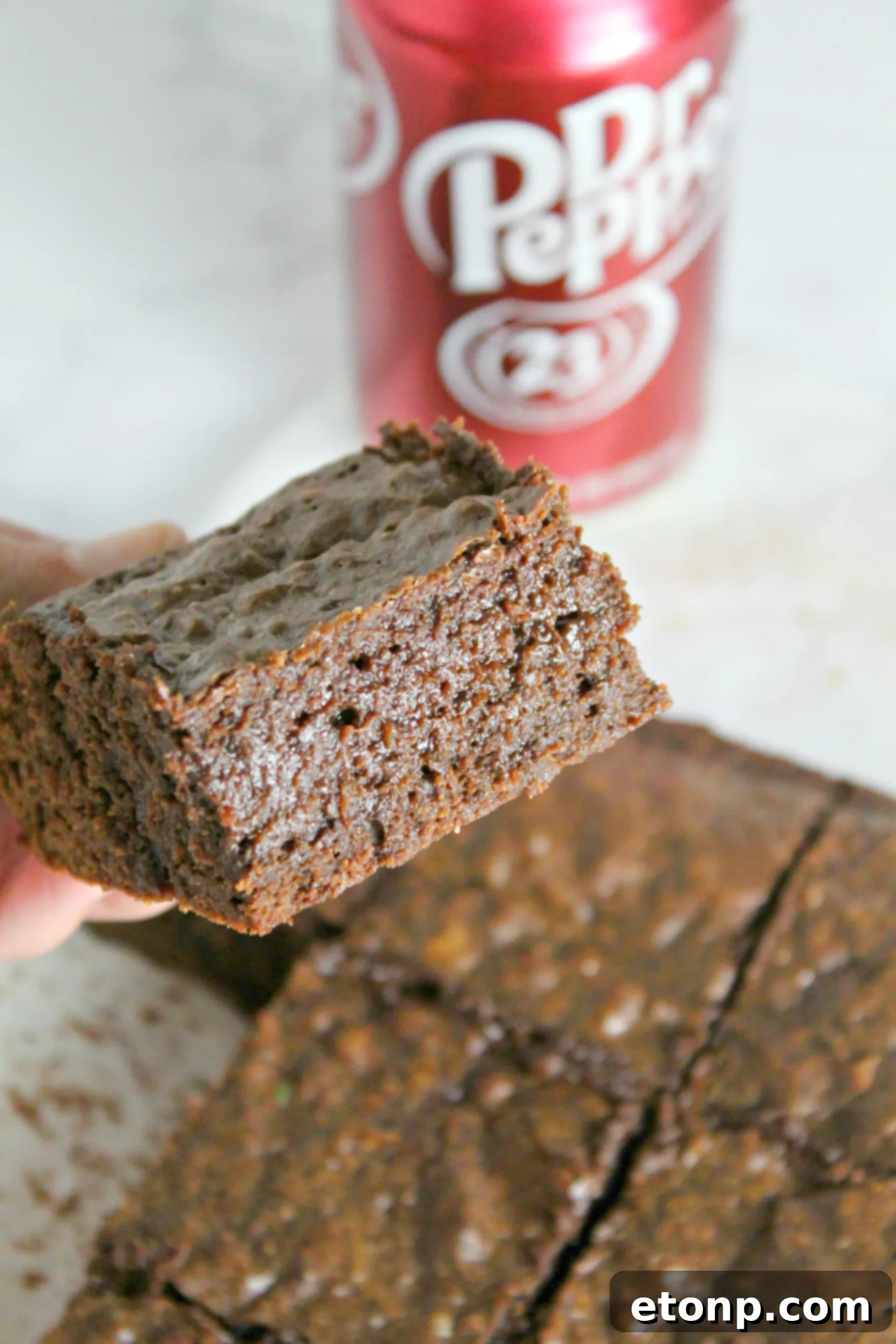 Decadent Dr Pepper Brownies 2 Close-up of freshly baked Dr. Pepper brownies, rich and fudgy