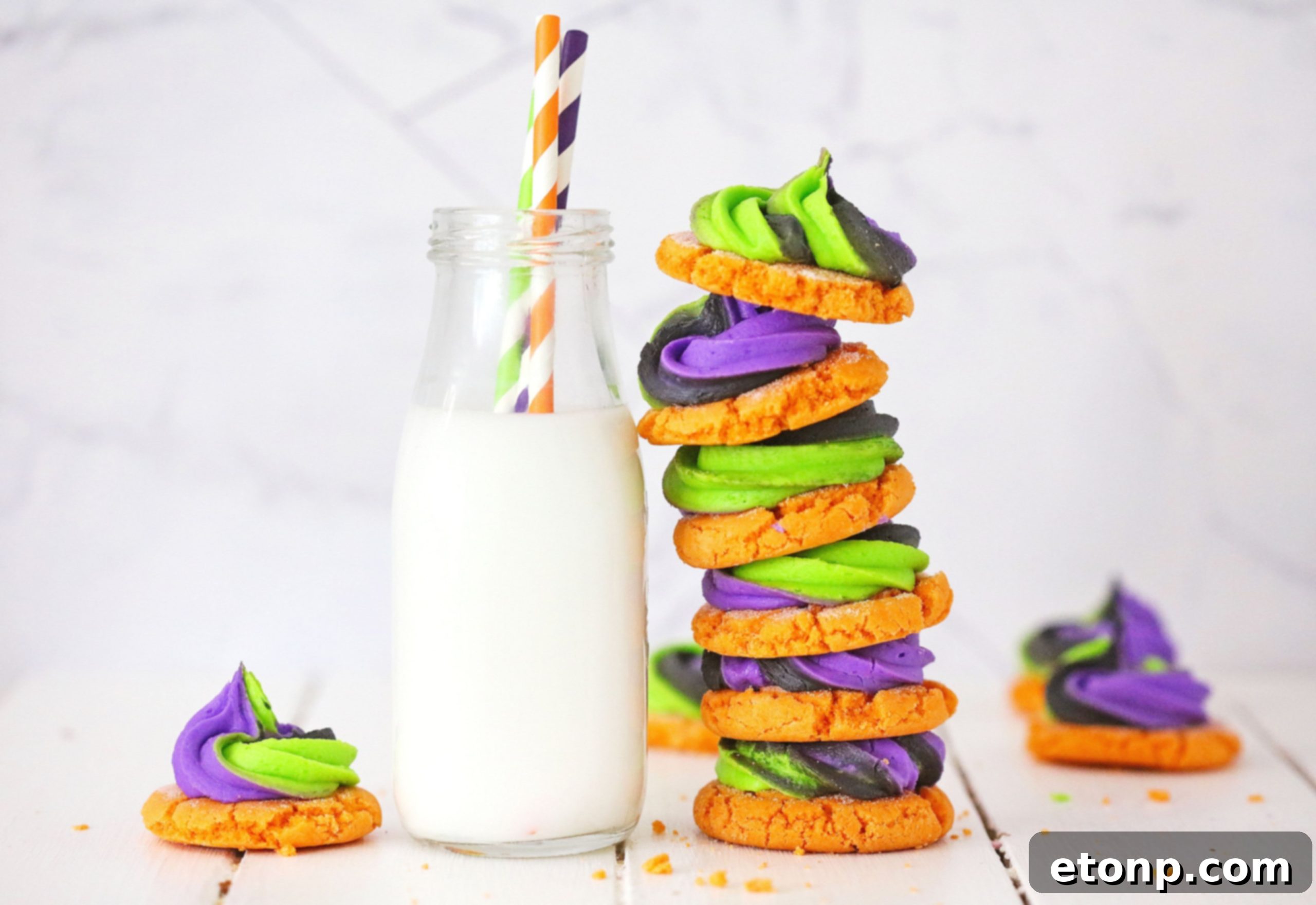 Deliciously decorated pumpkin sugar cookies on a cooling rack, ready for a fall gathering or Halloween party
