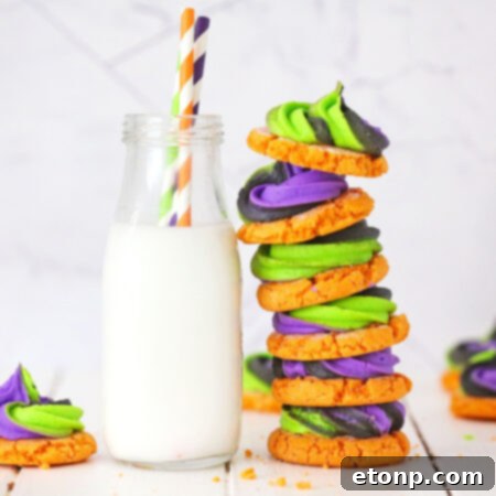 A single beautifully decorated pumpkin sugar cookie with swirling buttercream frosting.