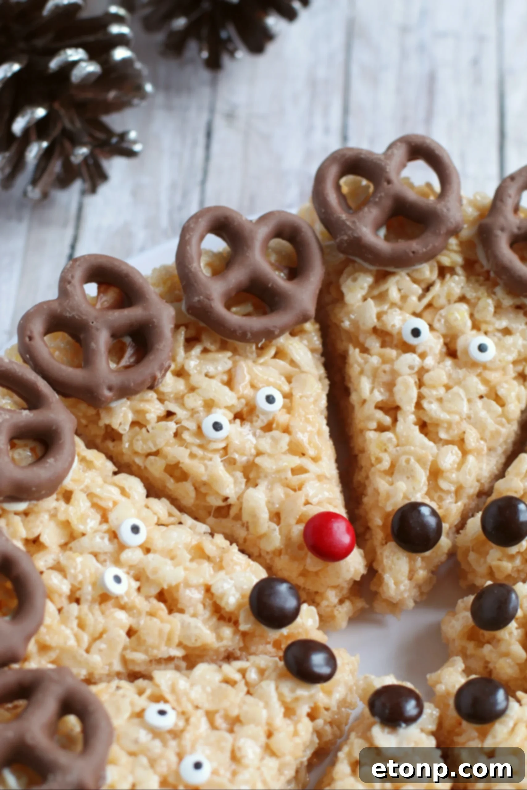 A tray of freshly made Rice Krispie Treats before being cut or decorated, showing their golden brown color.