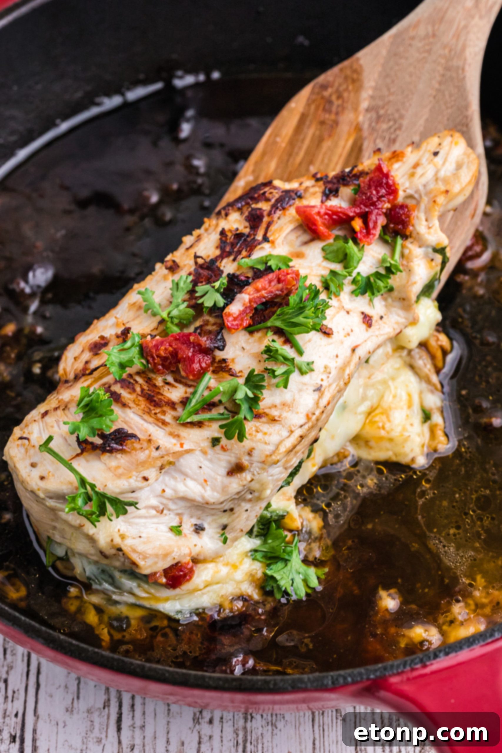 Finished stuffed chicken breast on a plate