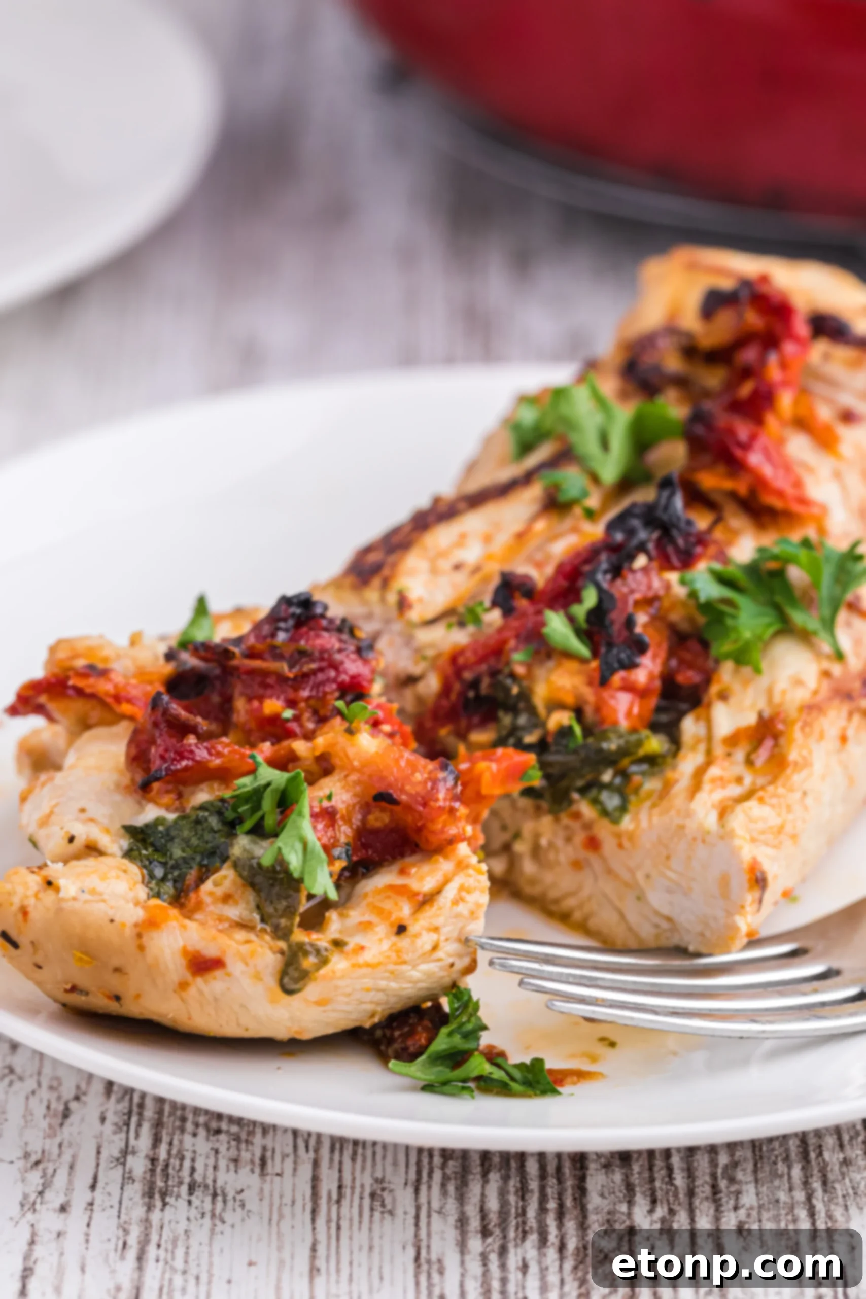 Stuffed Chicken Breast cooking in skillet