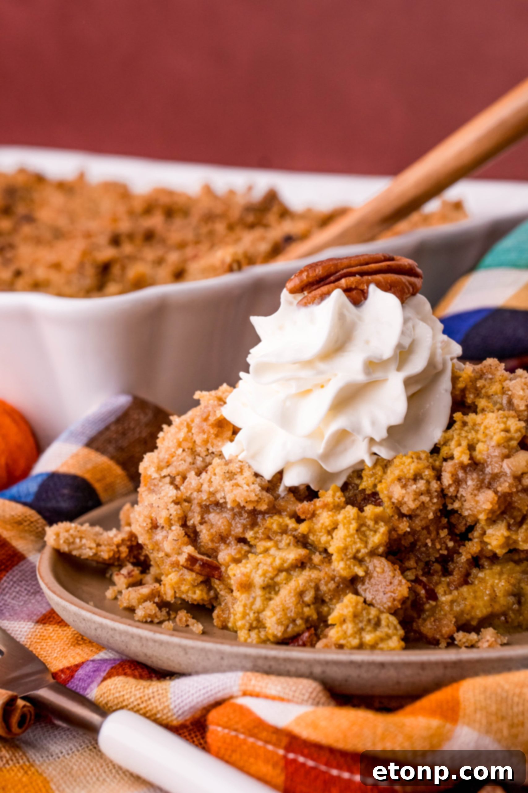A wider shot of the Pumpkin Pie Crisp, showing the full baking dish and its golden crust.