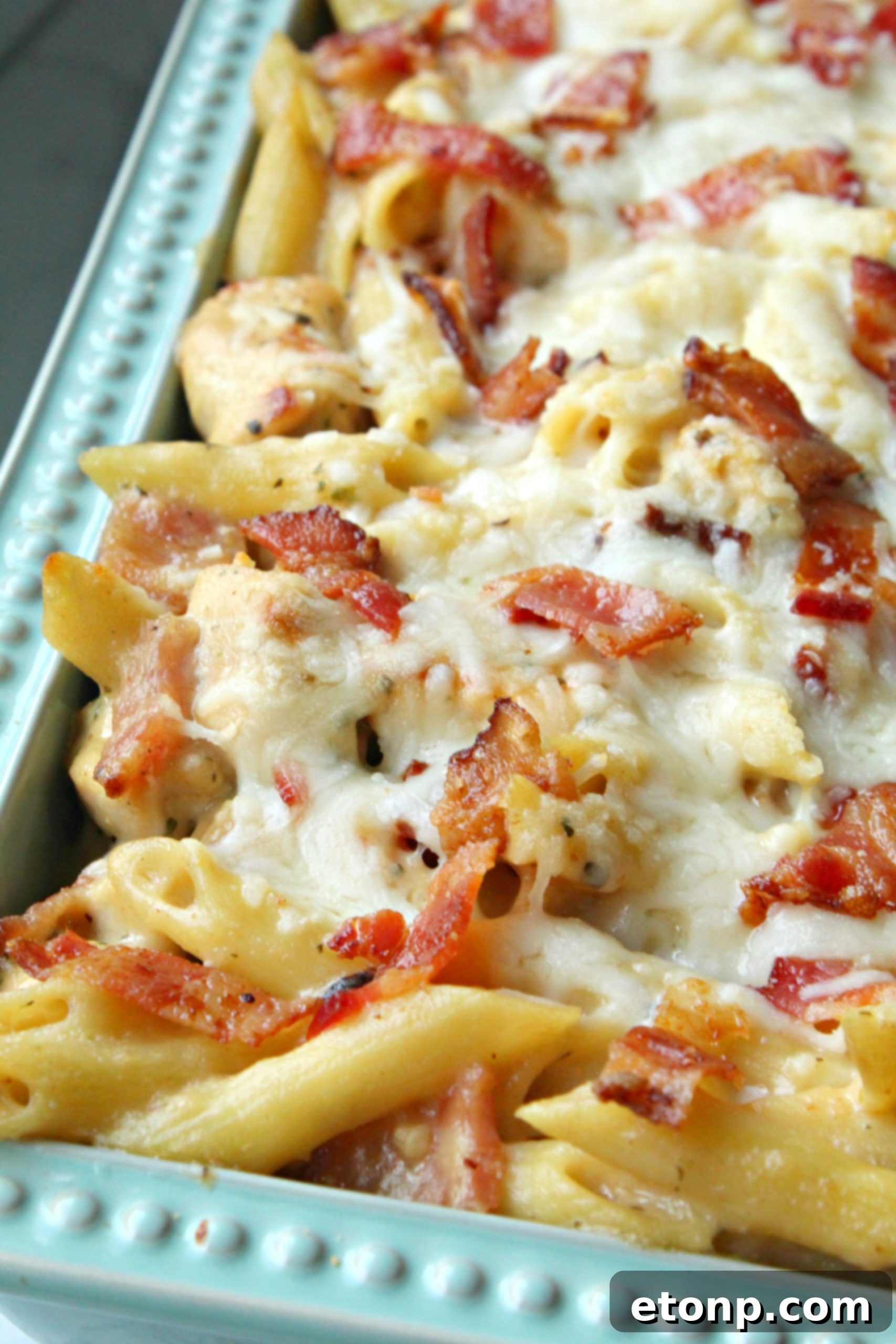 Ultimate Chicken Bacon Ranch Penne 9 A beautifully plated serving of Chicken Bacon Ranch Penne Casserole alongside a fresh green salad.