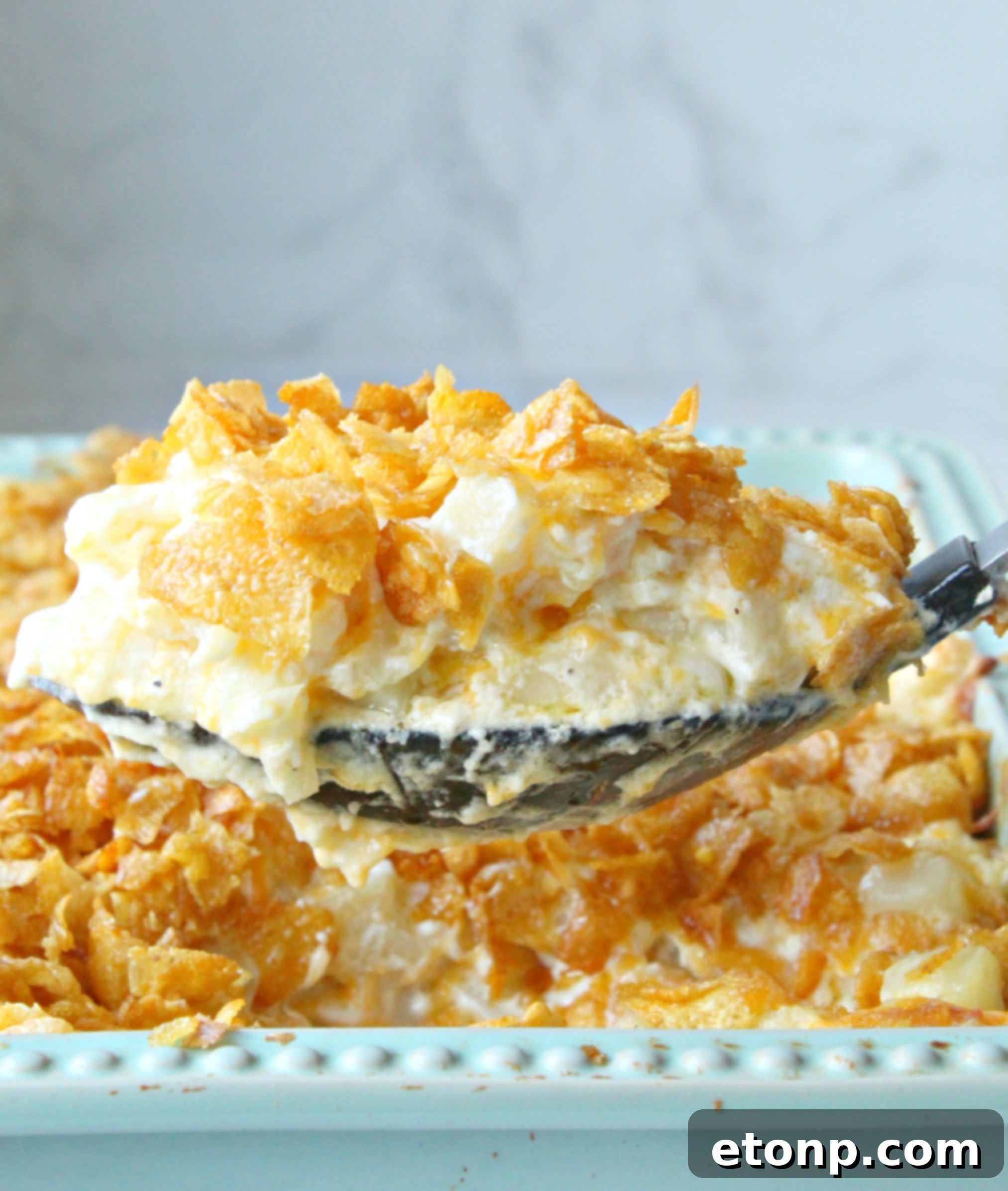 A bowl of sour cream with a spoon, offering an alternative for a creamy texture.