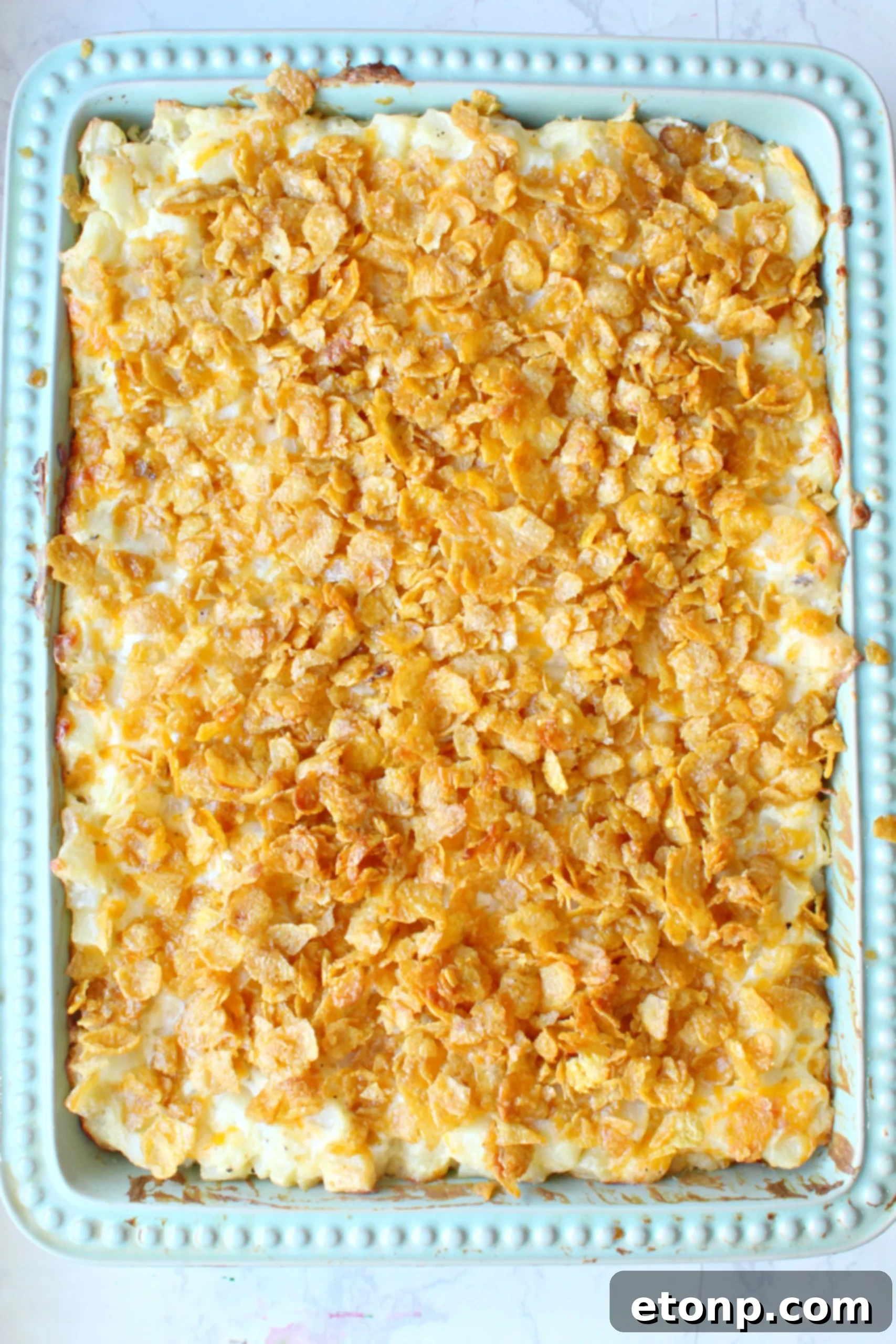 Ingredients for Funeral Potatoes laid out on a kitchen counter, showcasing fresh and pantry items.