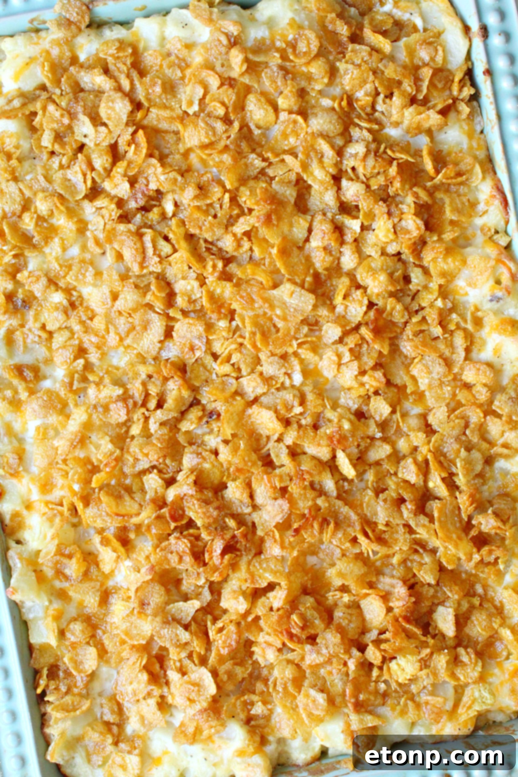 A bowl of fresh ingredients, including diced bell peppers and green onions, for customizing Funeral Potatoes.
