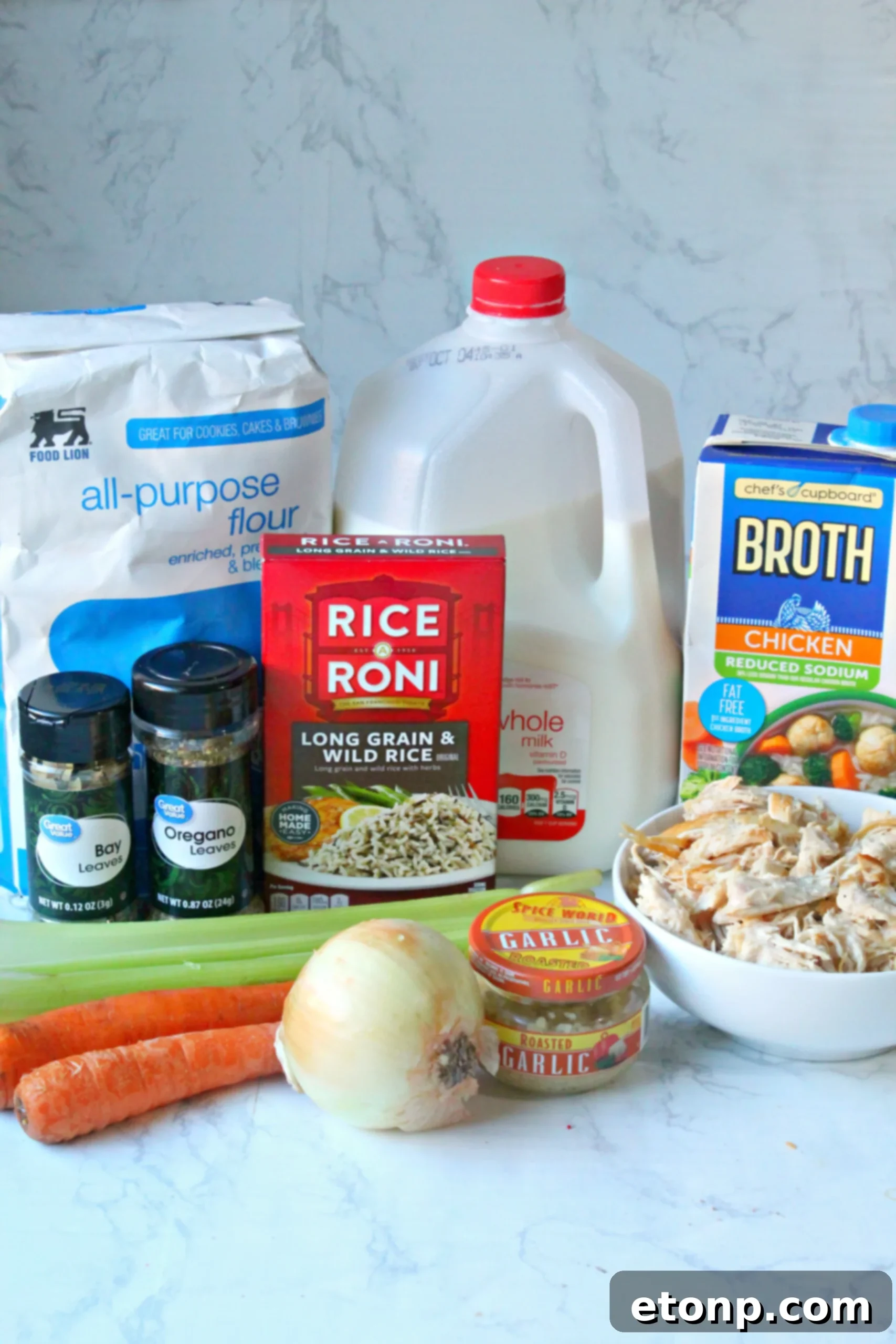 Close-up shot of the creamy texture and rich ingredients of homemade Chicken & Wild Rice Soup.