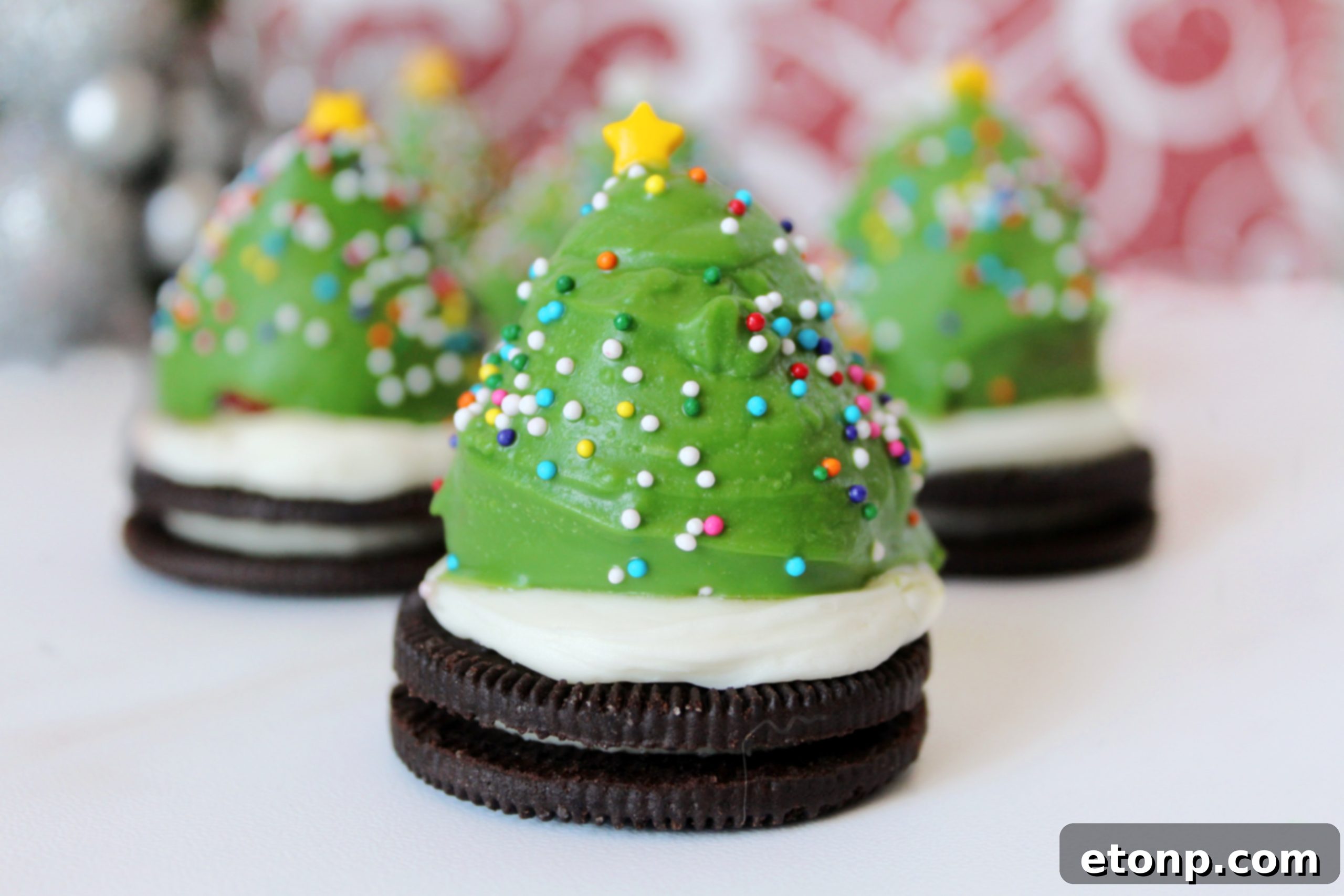 Chocolate Covered Strawberry Christmas Trees standing on Oreo cookie bases