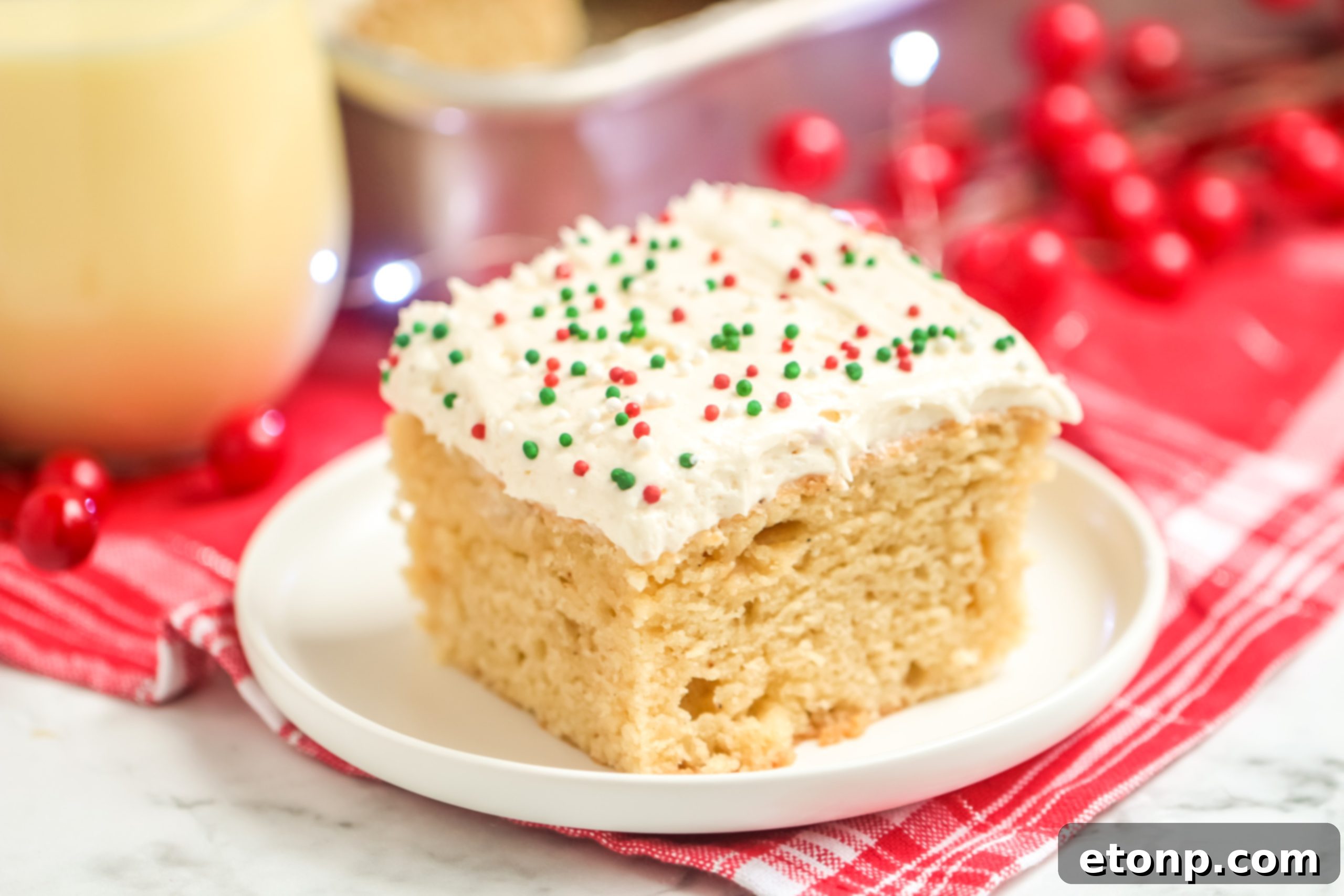 Holiday Eggnog Sheet Cake Delight 7 Another perspective of the whole Eggnog Sheet Cake, showcasing its festive sprinkles and readiness for serving.
