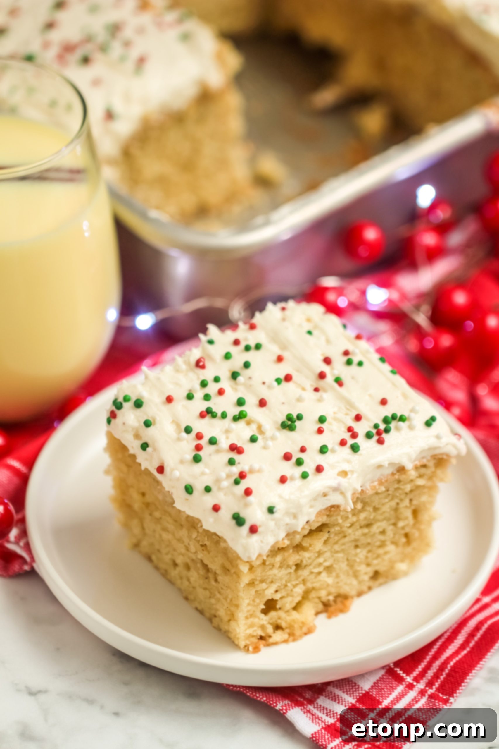 Holiday Eggnog Sheet Cake Delight 8 Eggnog Sheet Cake cut into squares, showing its inviting texture and thick layer of frosting.