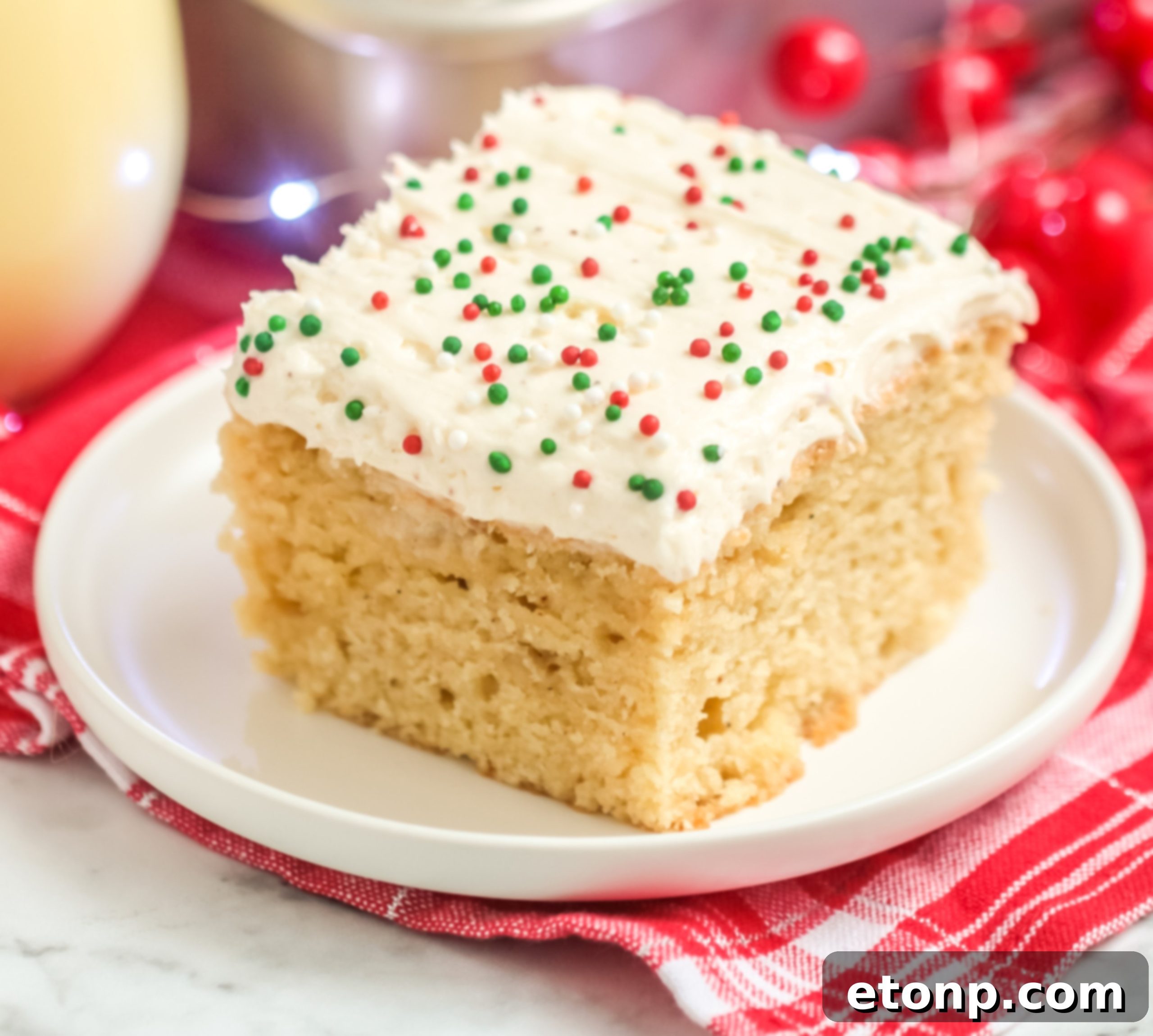 Holiday Eggnog Sheet Cake Delight 10 A wider shot of the Eggnog Sheet Cake on a festive table, emphasizing its presentation and holiday spirit.