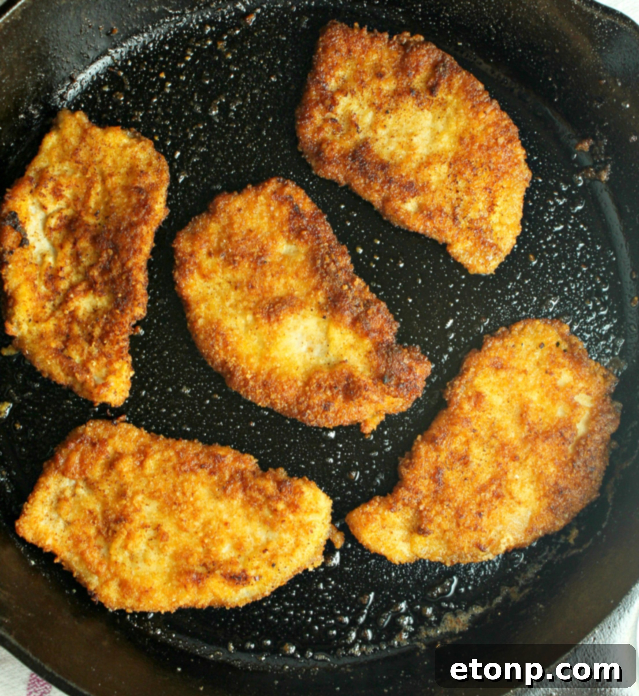 Close-up of golden-brown Pork Schnitzel, ready to be enjoyed