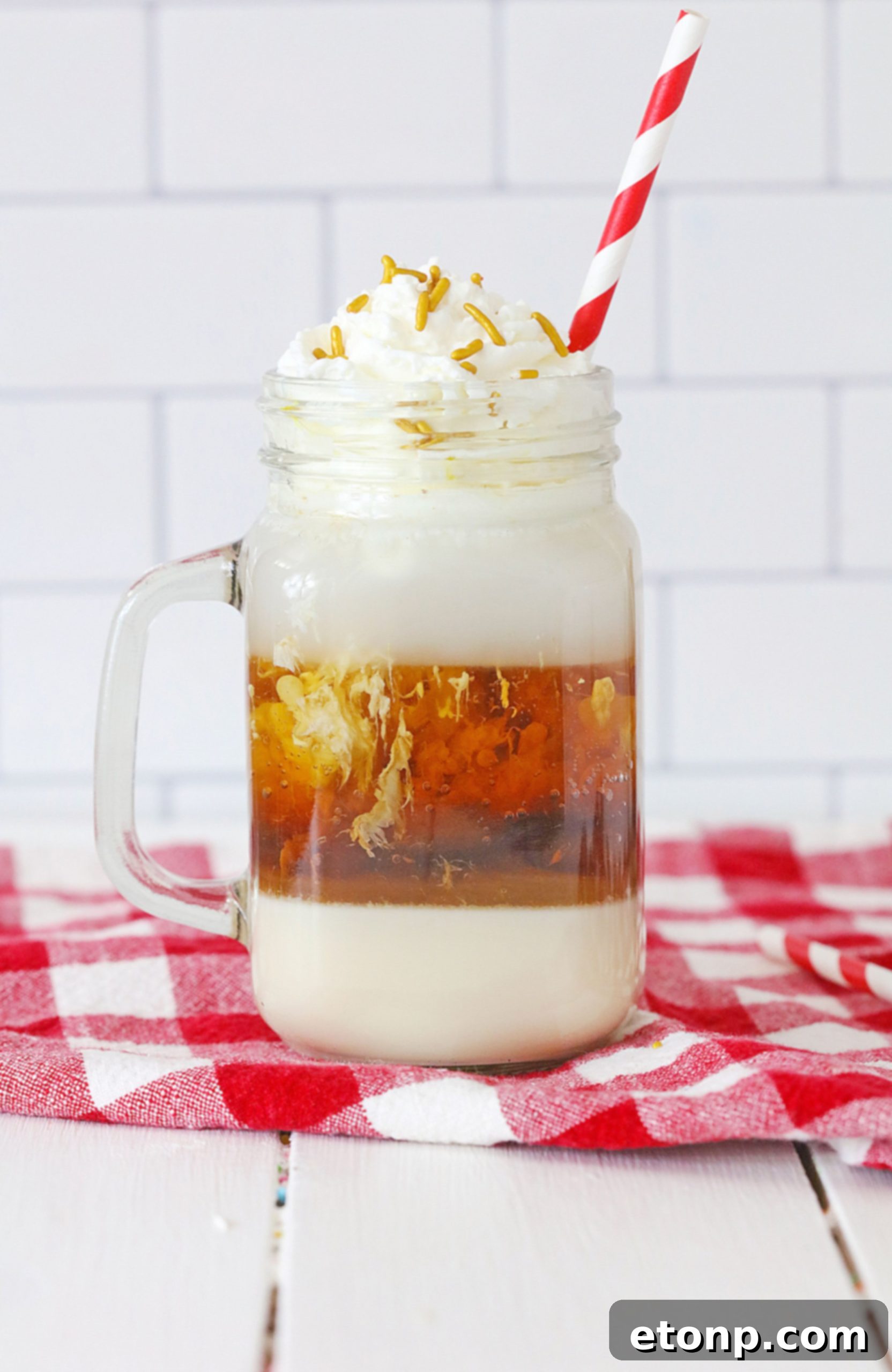 Decadent Layered Root Beer Float Cocktail 4 Ingredients for a Layered Root Beer Float Cocktail laid out on a table.