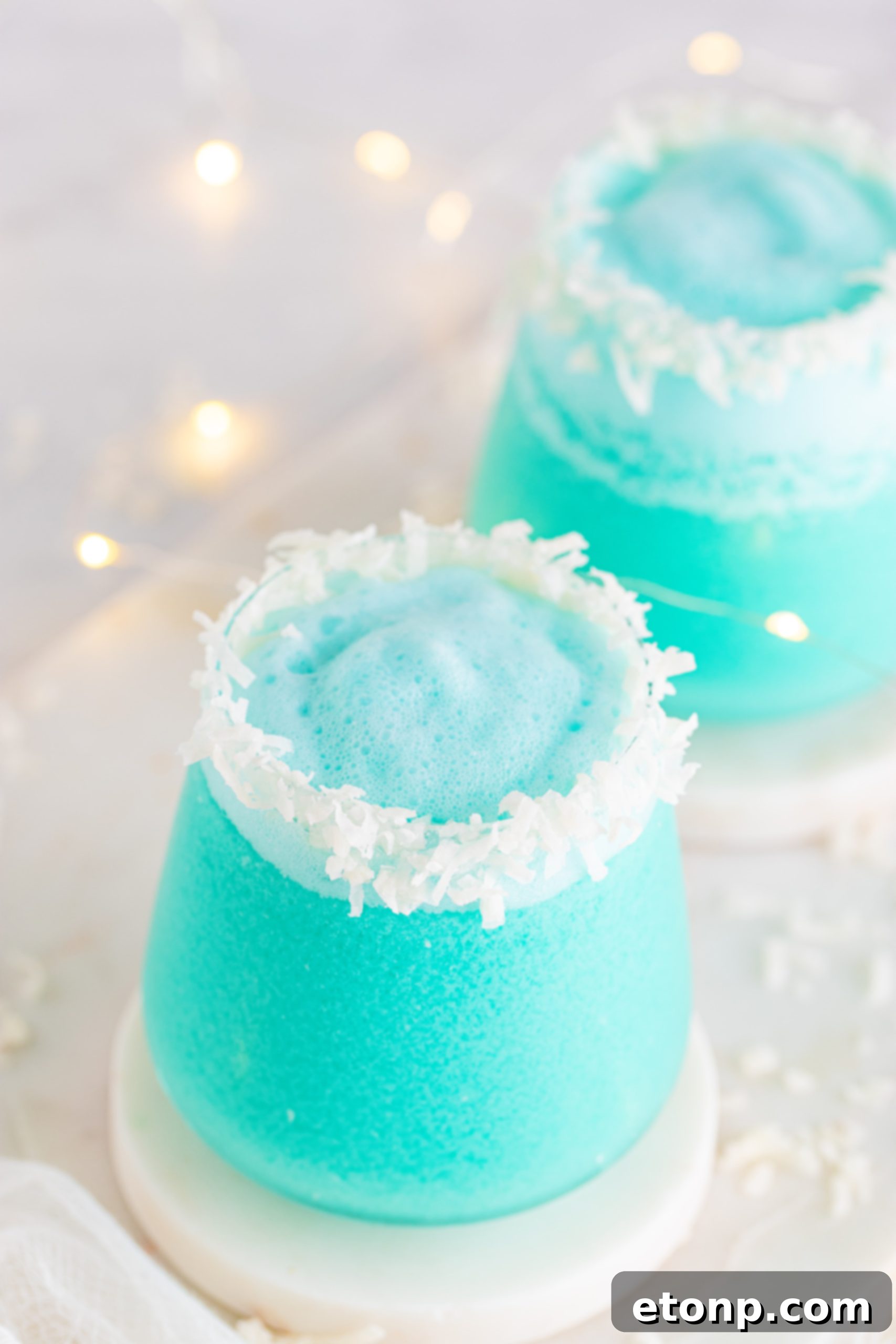 A close-up shot of a single Jack Frost Cocktail in a tall glass
