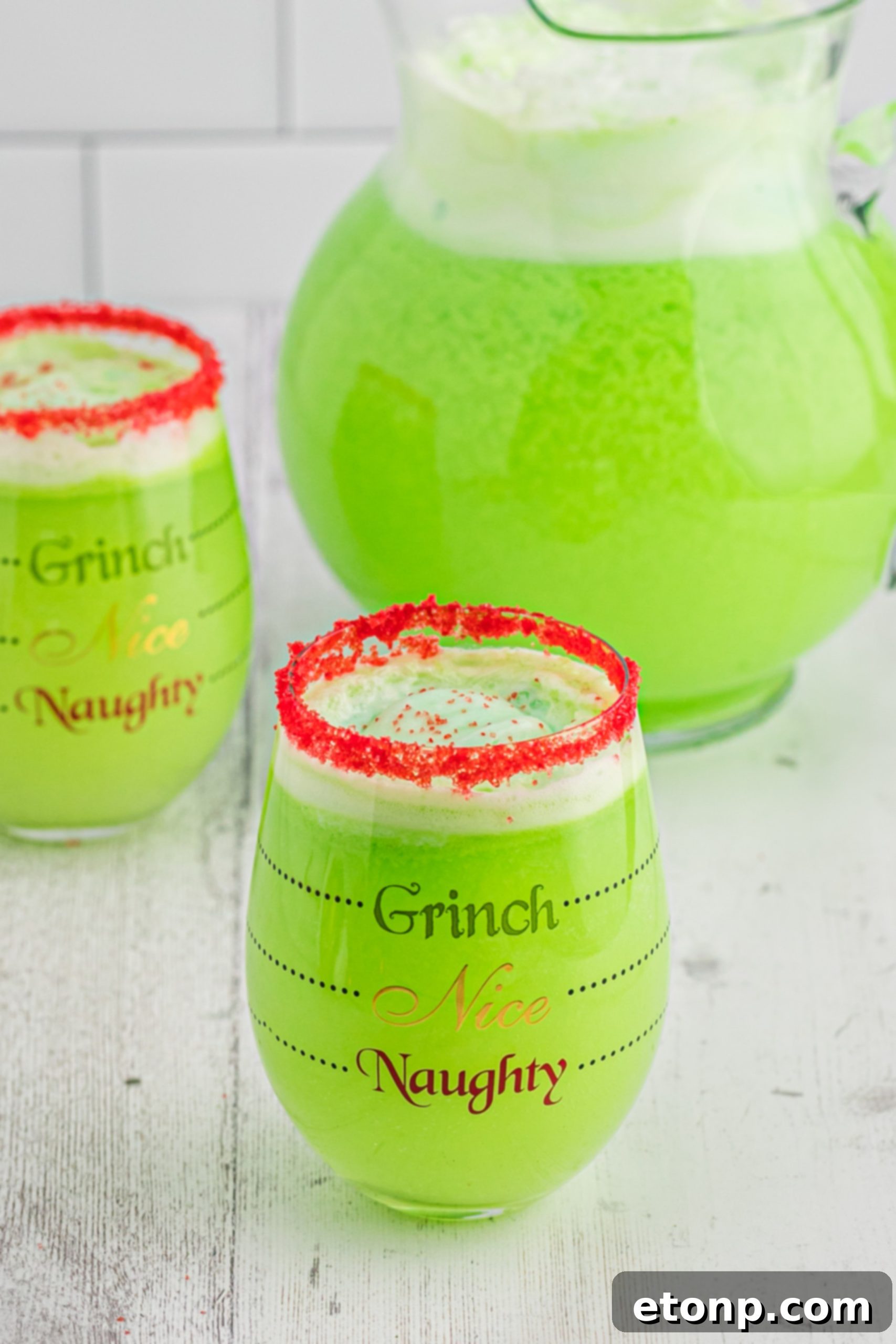 The Grinch's Heart-Growing Holiday Brew 7 Another perspective of the festive Grinch Punch, showcasing its vibrant color and inviting froth.