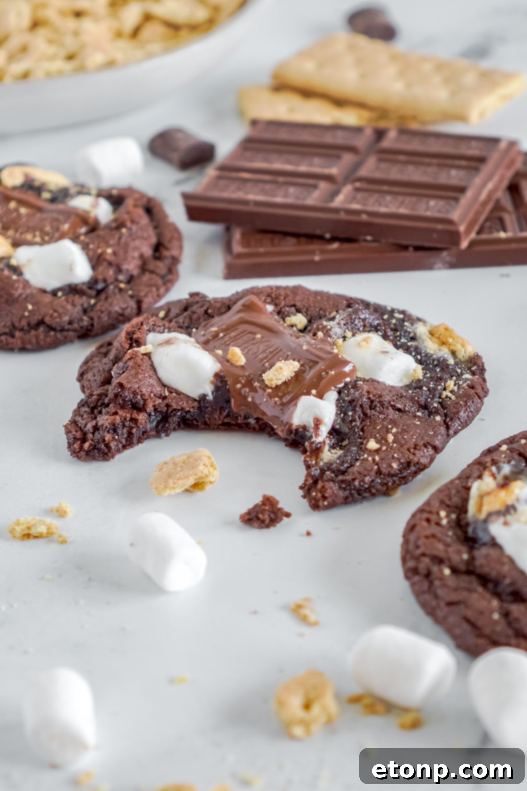 A stack of freshly baked Hershey's Chocolate S'mores Cookies, highlighting their rich color and inviting texture.