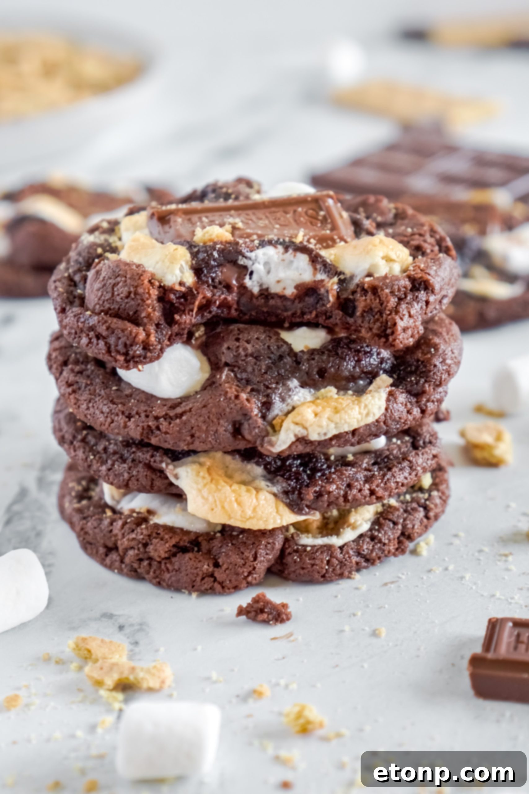 An array of freshly baked Hershey's Chocolate S'mores Cookies cooling on a wire rack, ready to be enjoyed.