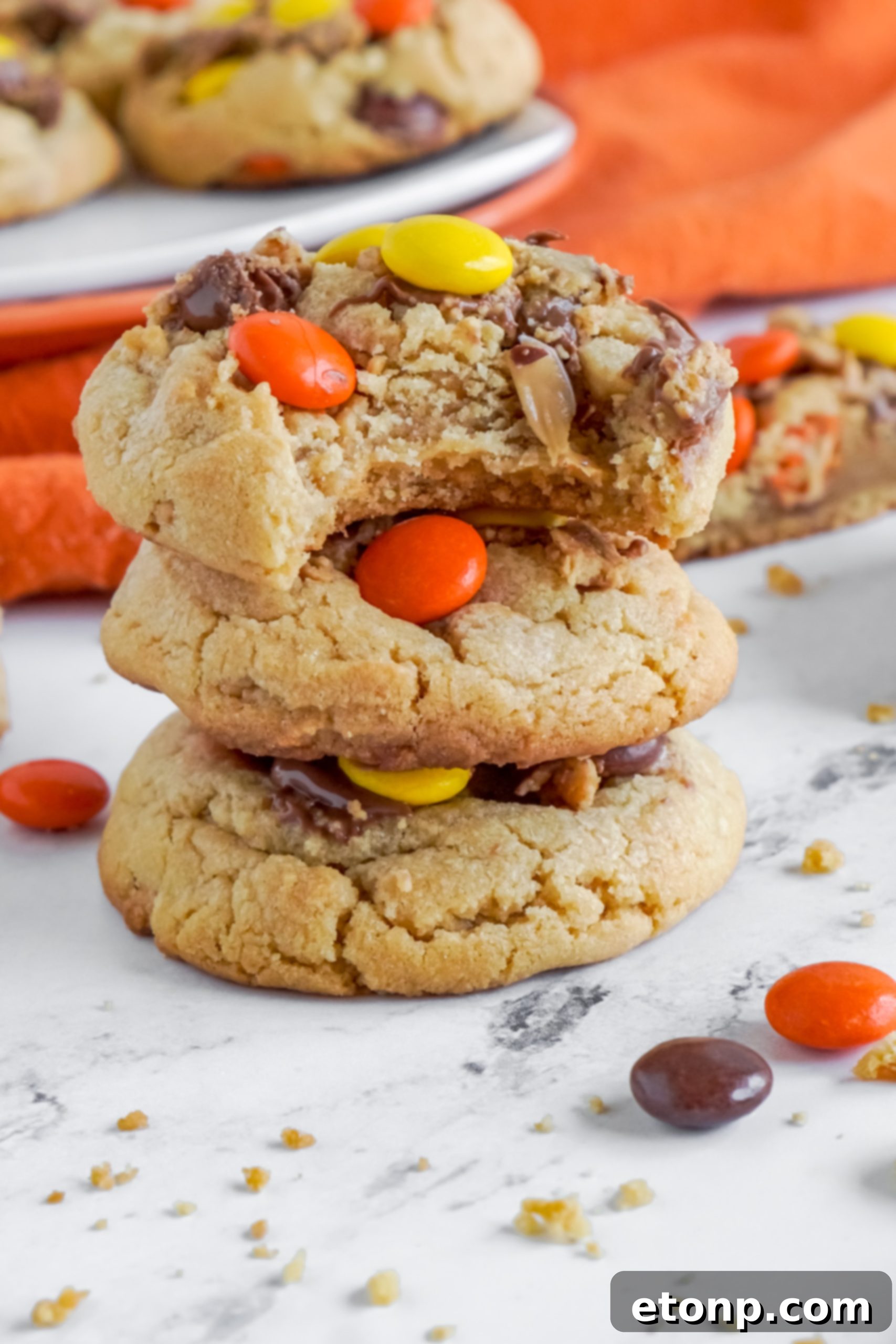 A baking sheet with finished Reese's Peanut Butter Cup Cookies, fresh from the oven and cooling.