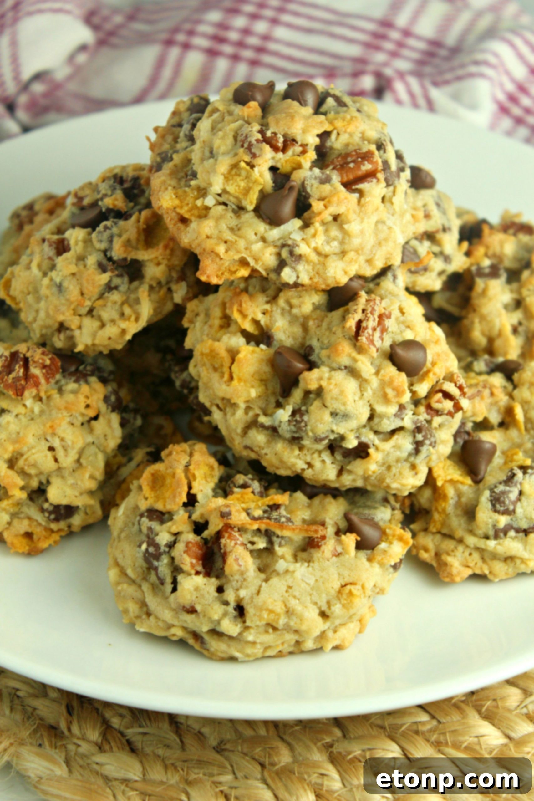 Freshly baked Cowboy Cookies cooling on a wire rack.
