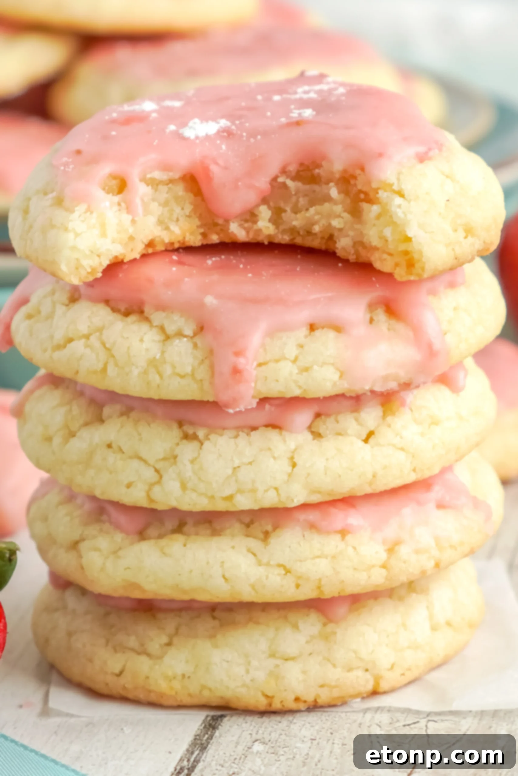 A beautifully arranged plate of Strawberry Glazed Sugar Cookies