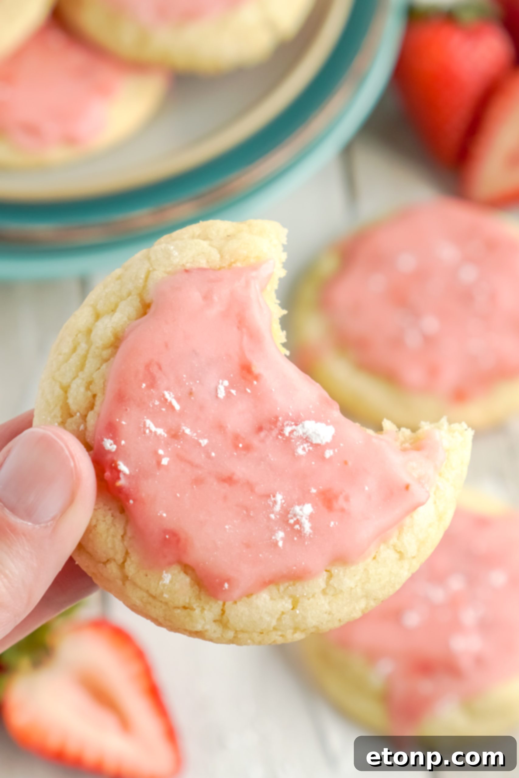 A plate of finished Strawberry Glazed Sugar Cookies