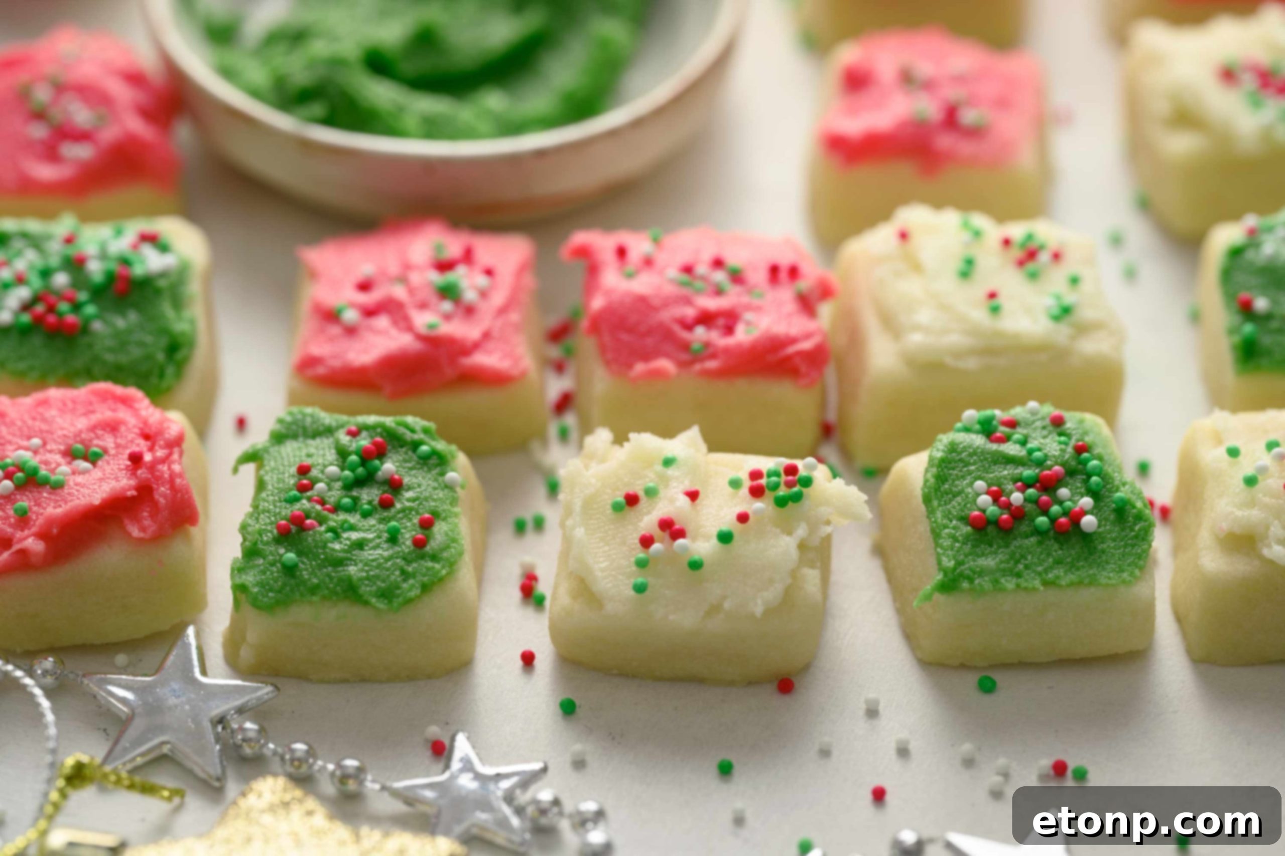 A festive holiday tableau with Christmas Sugar Cookie Bites and other decorations, evoking a cozy winter atmosphere.