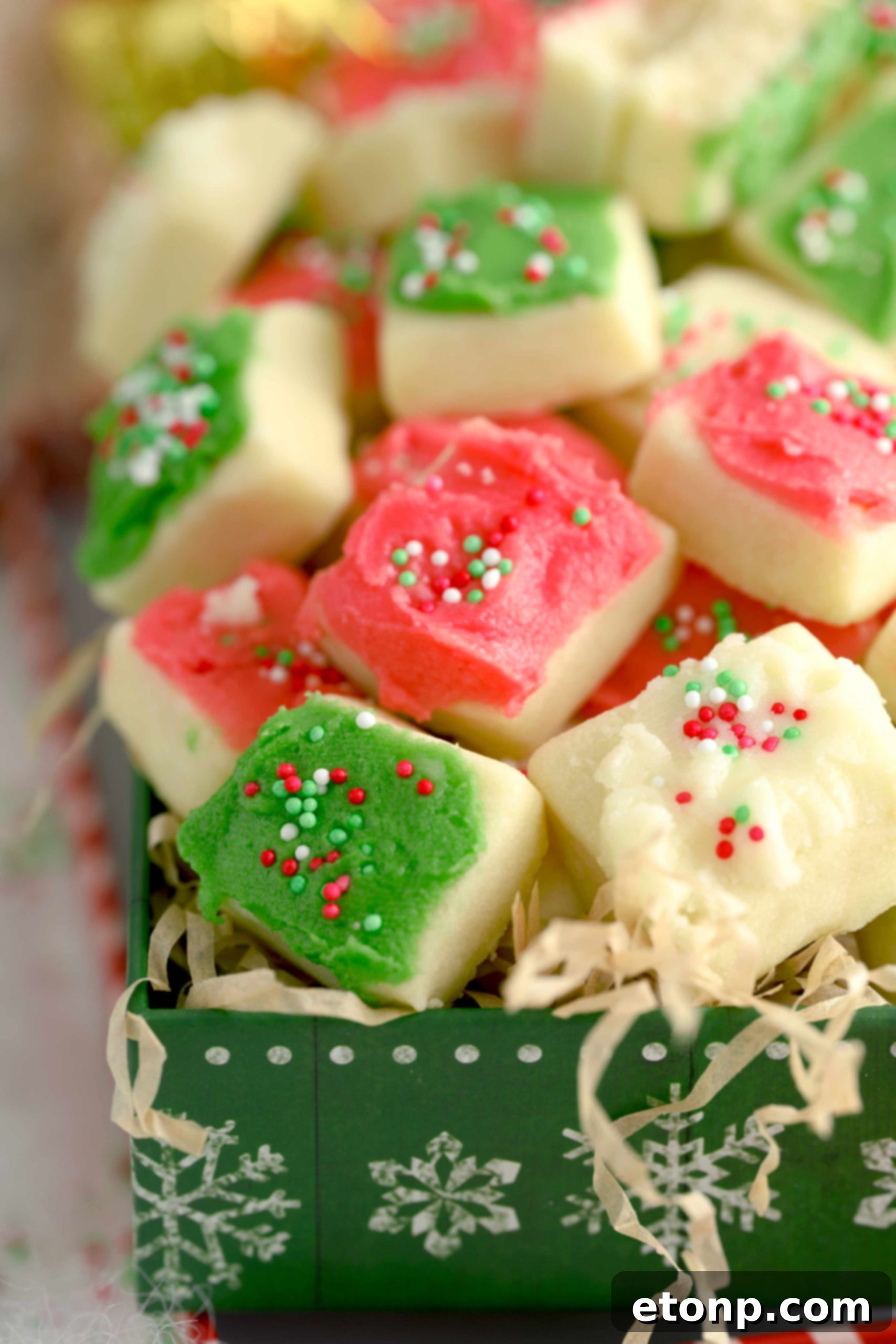 More Christmas Sugar Cookie Bites, some with white frosting, adding variety to the festive display.